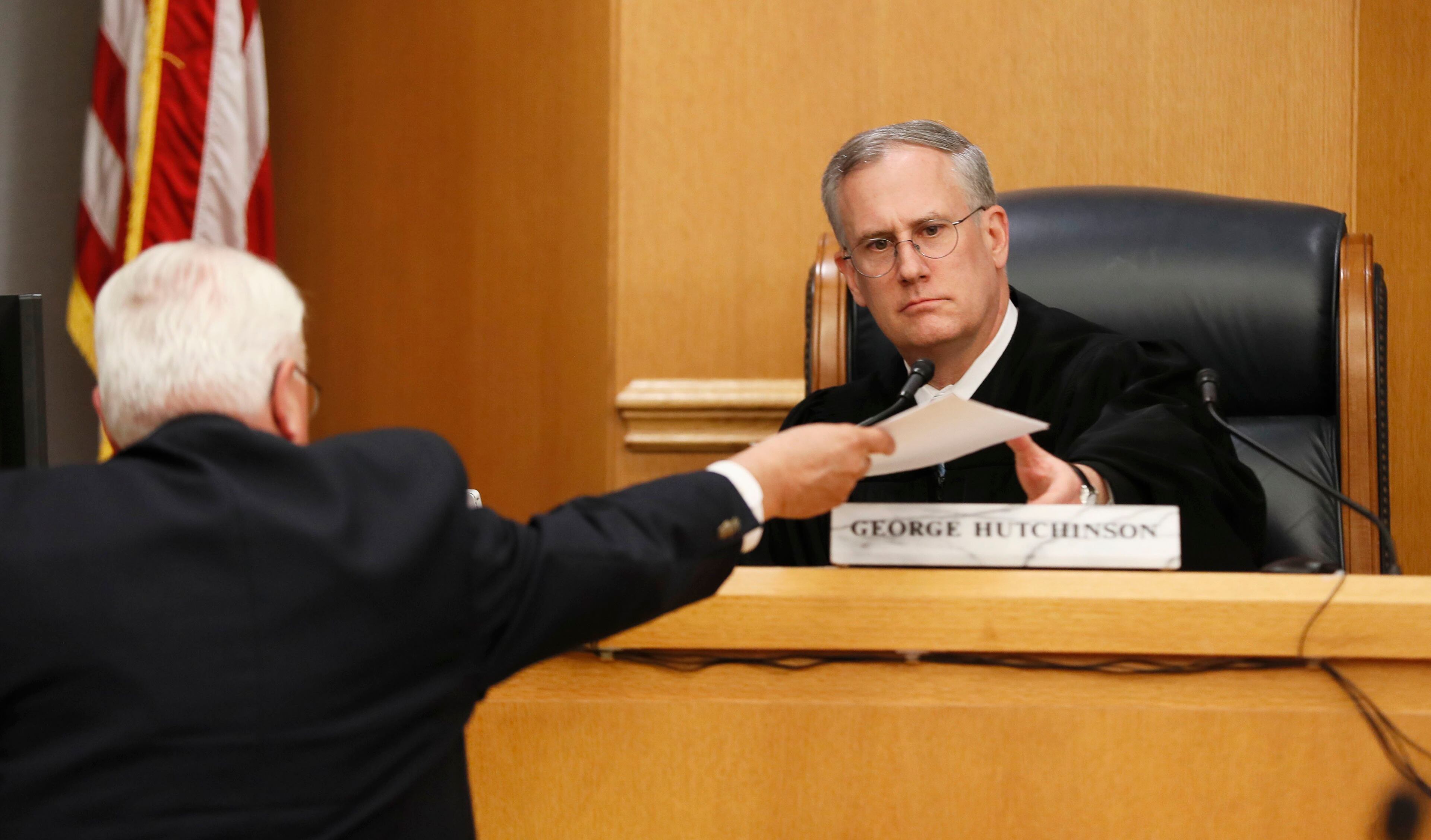 April 29, 2019 - Lawrenceville - Judge George Hutchinson receives the jury's verdict from the bailiff. A jury found Tiffany Moss, who is representing herself, guilty of intentionally starving her 10-year-old stepdaughter Emani to death in the fall of 2013, in addition to other charges. Bob Andres / bandres@ajc.com