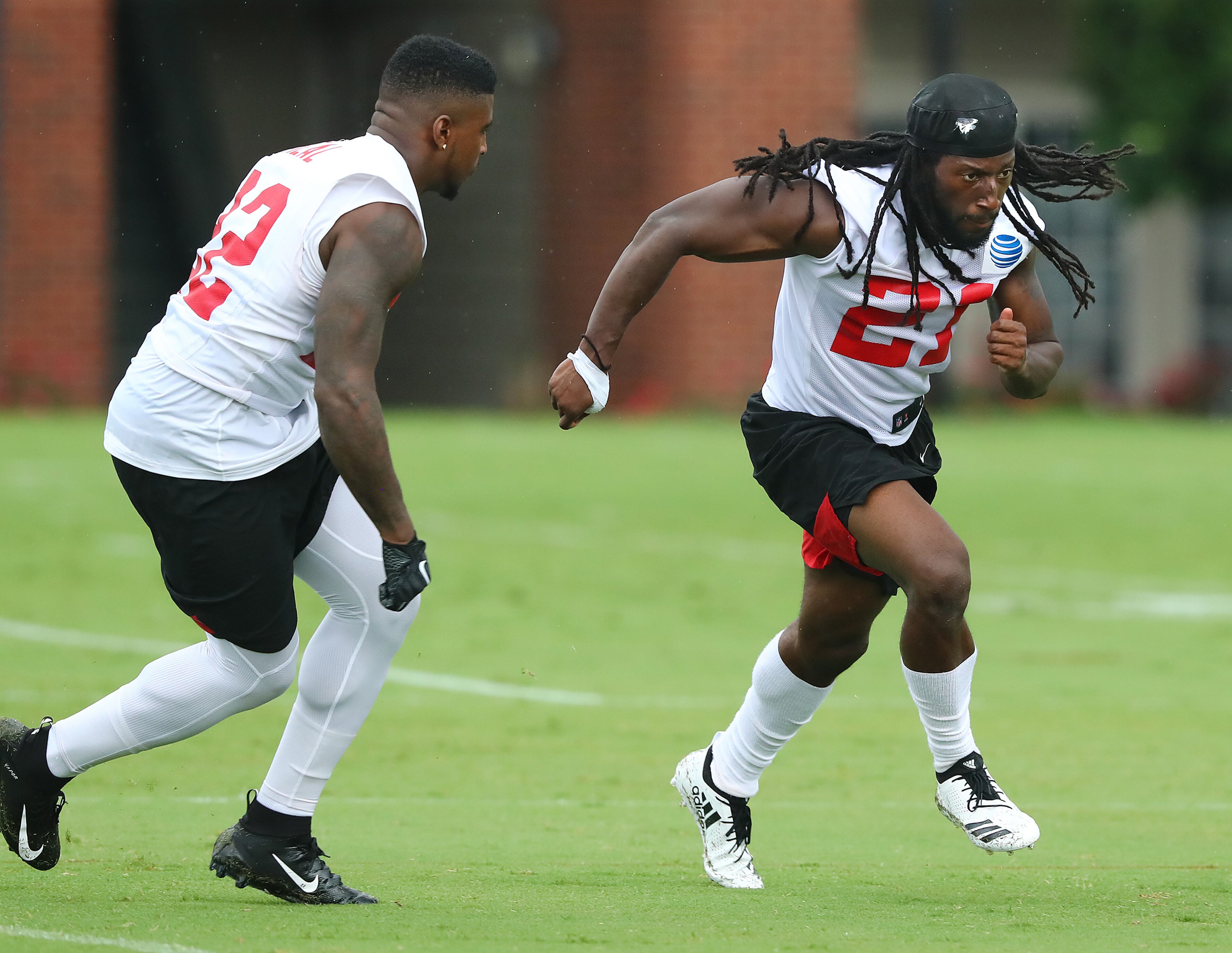 Falcons cornerback Desmond Trufant (right) gets in some extra work with safety Keanu Neal. Curtis Compton/ccompton@ajc.com