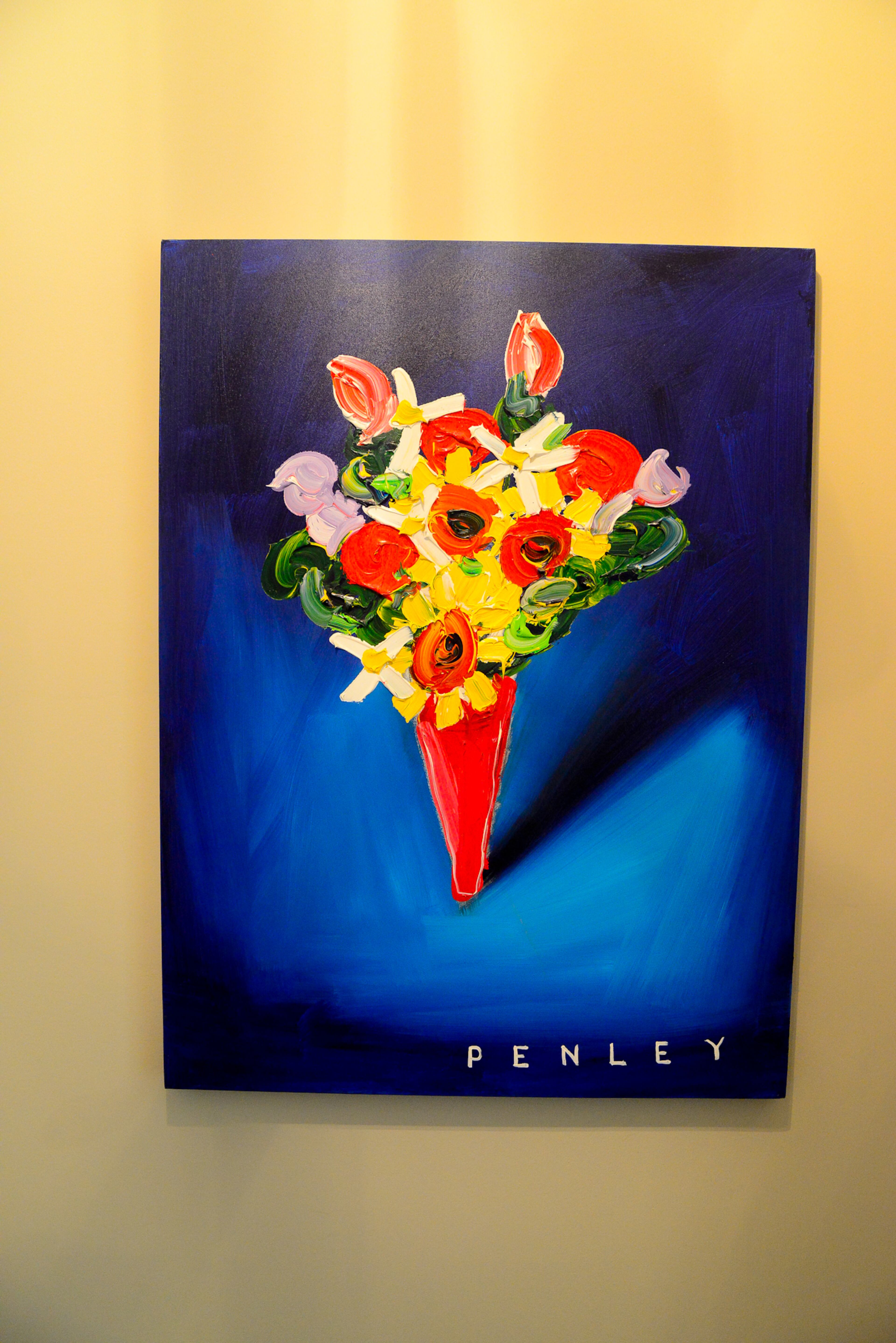 A flower painting by Steve Penley is among the vibrant pieces of art throughout the Atlanta townhome.