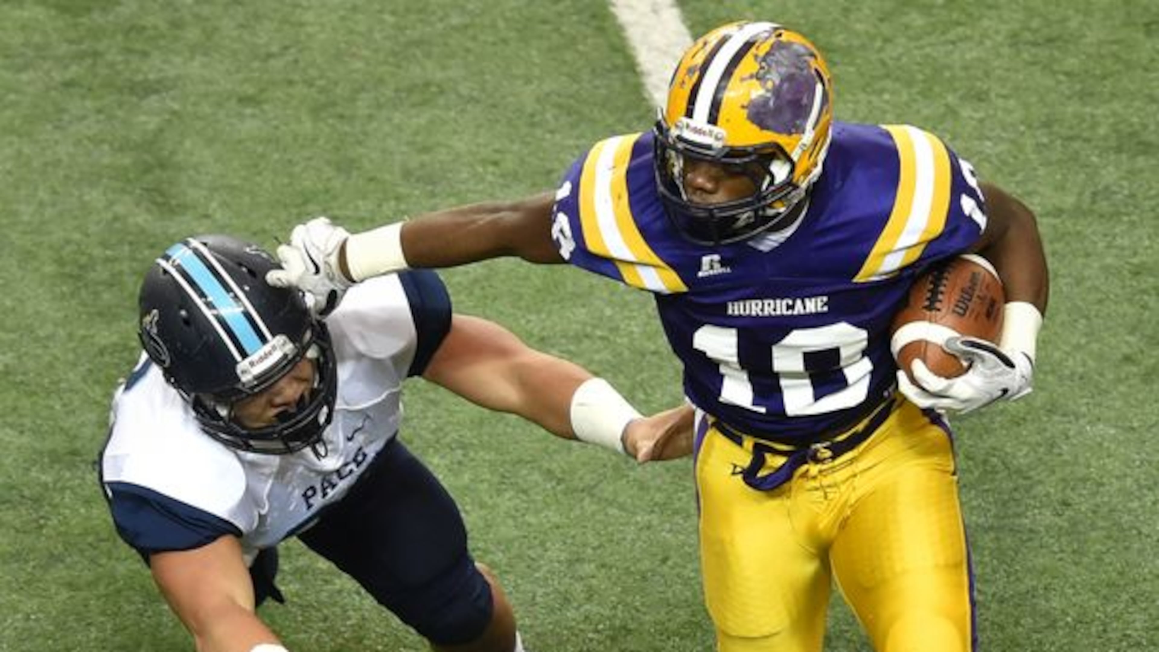 Fitzgerald's JD King carries the ball in last year's AA title game. The No. 2 Purple Hurricane will play top-ranked Benedictine on Saturday, 1 p.m. at the Georgia Dome to decide this year's AA title. (Brant Sanderlin for the AJC)