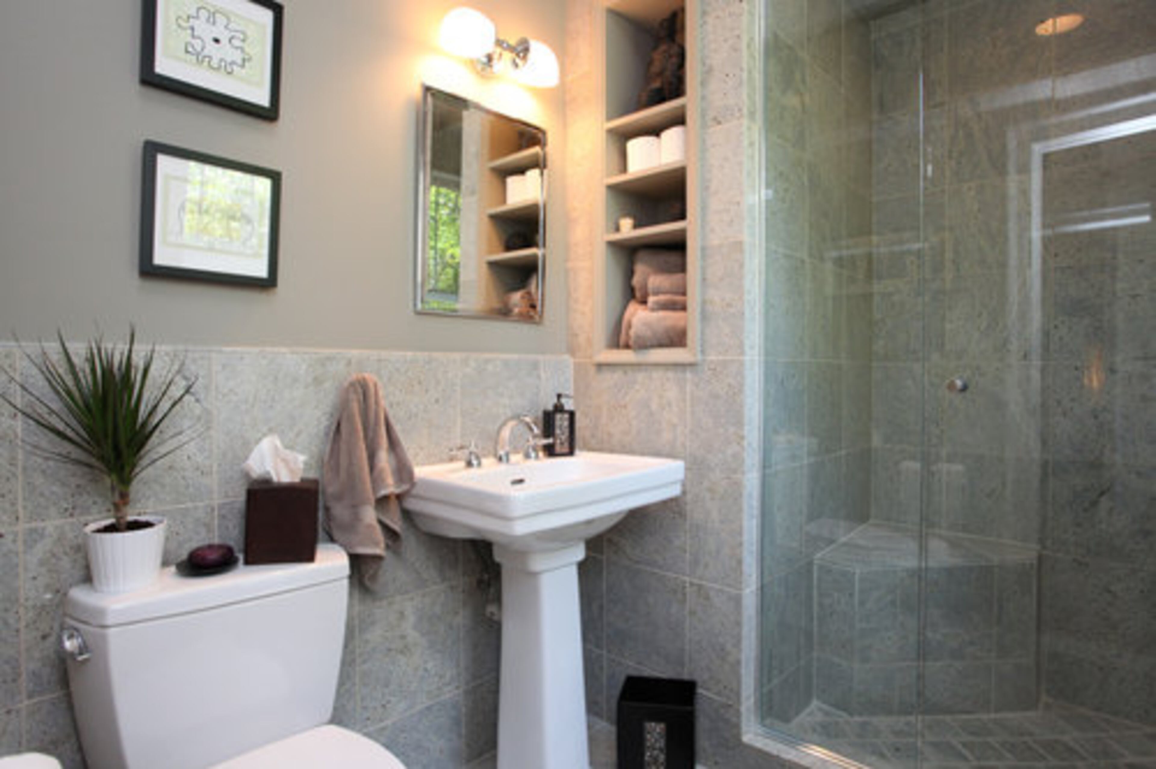 When it comes to bathrooms, homeowners are sometimes tempted to go for vivid colors. A better choice -- illustrated in this Decatur bathroom -- is using gray tones balanced with accessories like art, towels and plants that offer complementary jolts of color, said real estate agent Troy Wells.