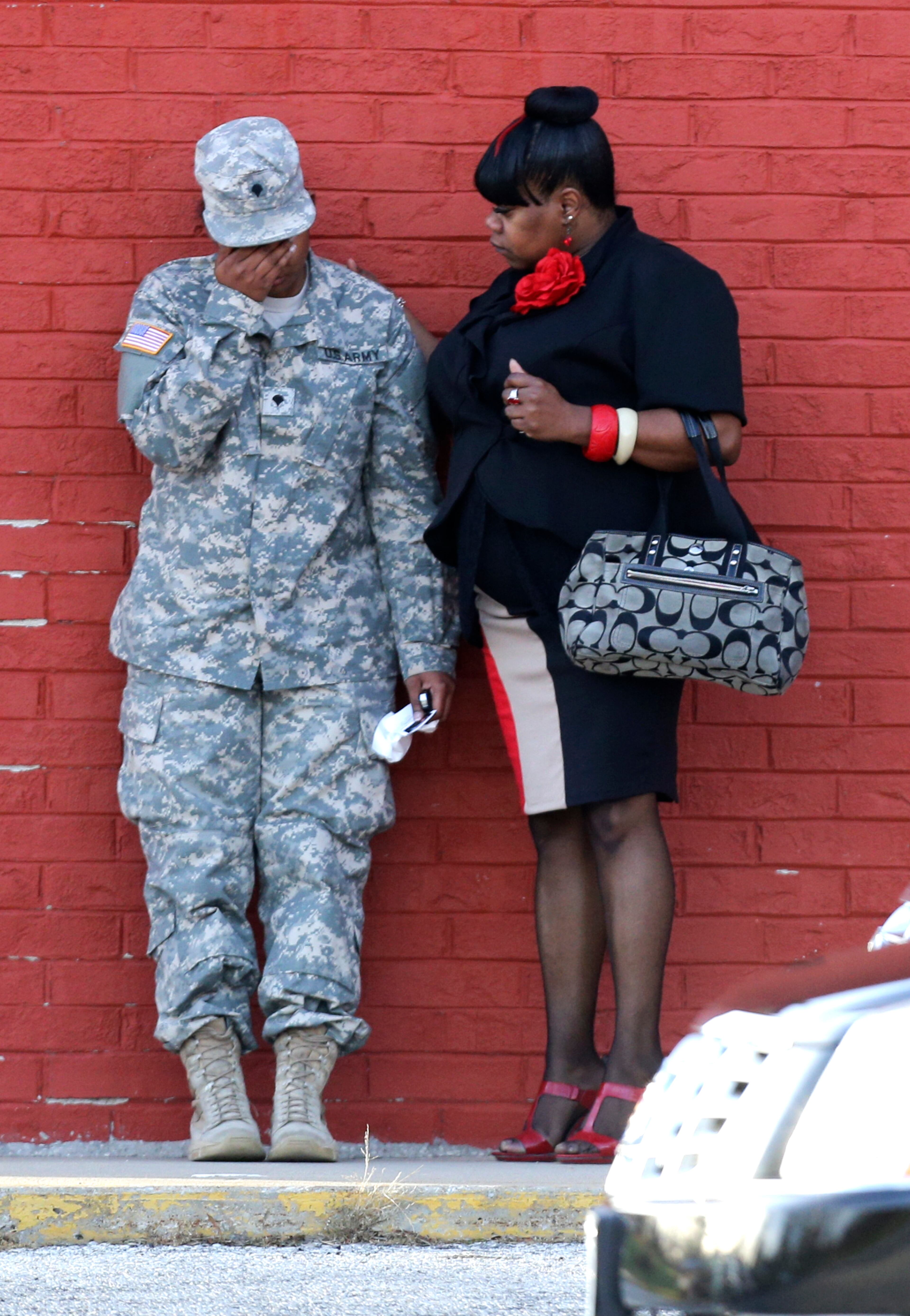 A woman is consoled by another as they leave a memorial service for Kansas City Chiefs football player Jovan Belcher. | Teammates attend memorial | More photos: Families grieving | Controversy over Costas’s comments