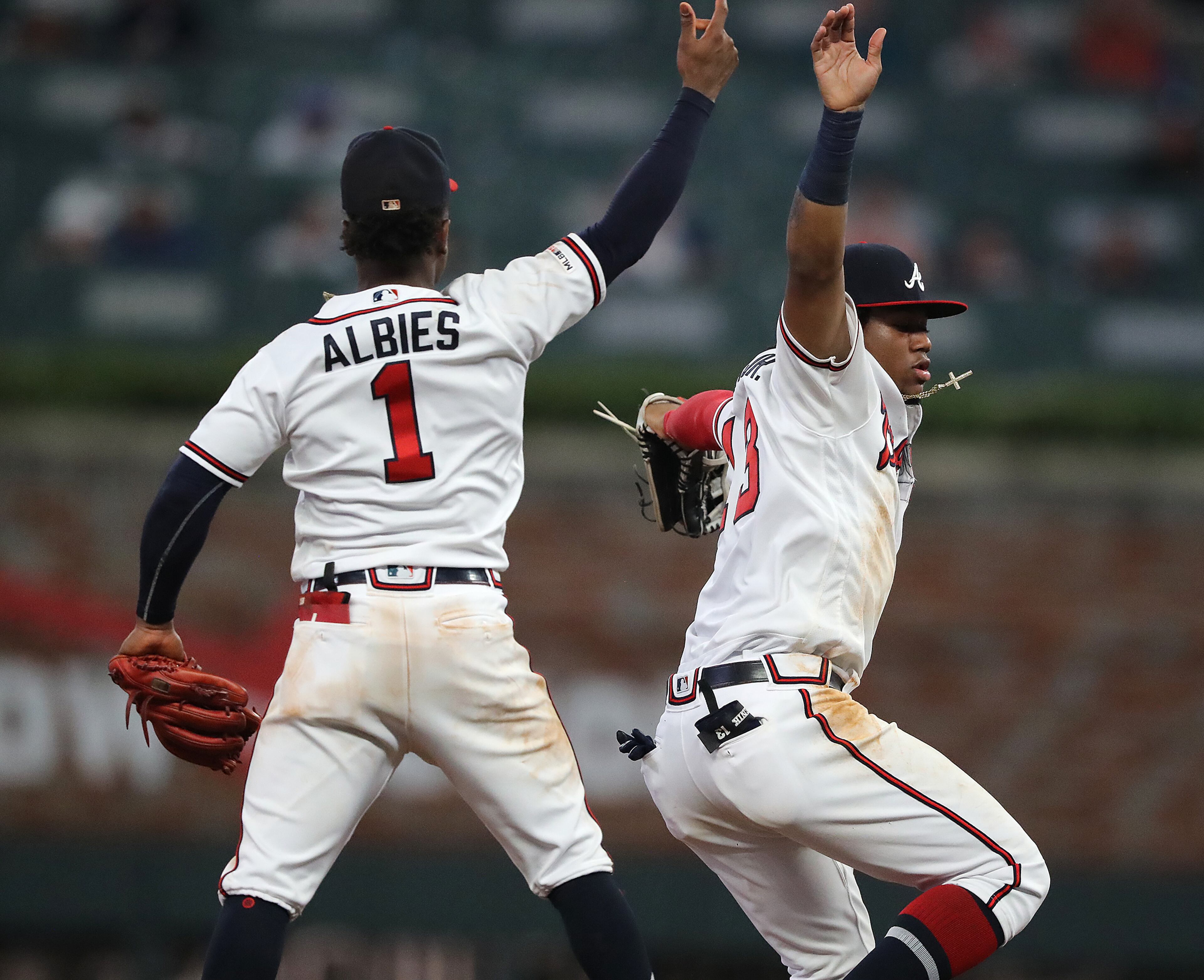 Braves Ozzie Albies and Ronald Acuna Jr. celebrate a 5-3 victory over the New York Mets. Curtis Compton/ccompton@ajc.com