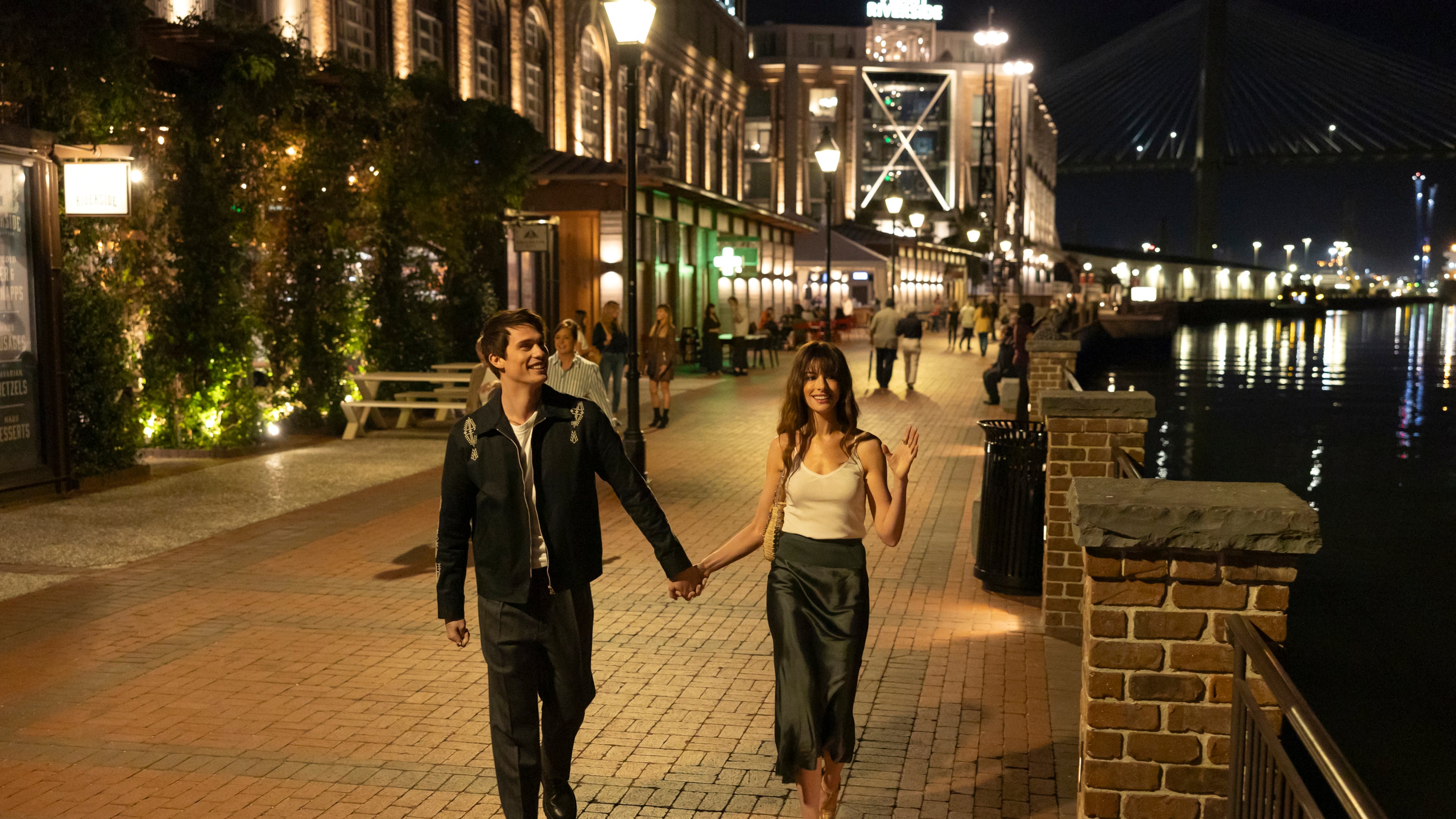 Nicholas Galitzine, left, and Anne Hatheway in “The Idea of You." They are in Savannah, which masquerades as a European city while the fictional band August Moon is on tour. (Alisha Wetherill/Prime Video/TNS)