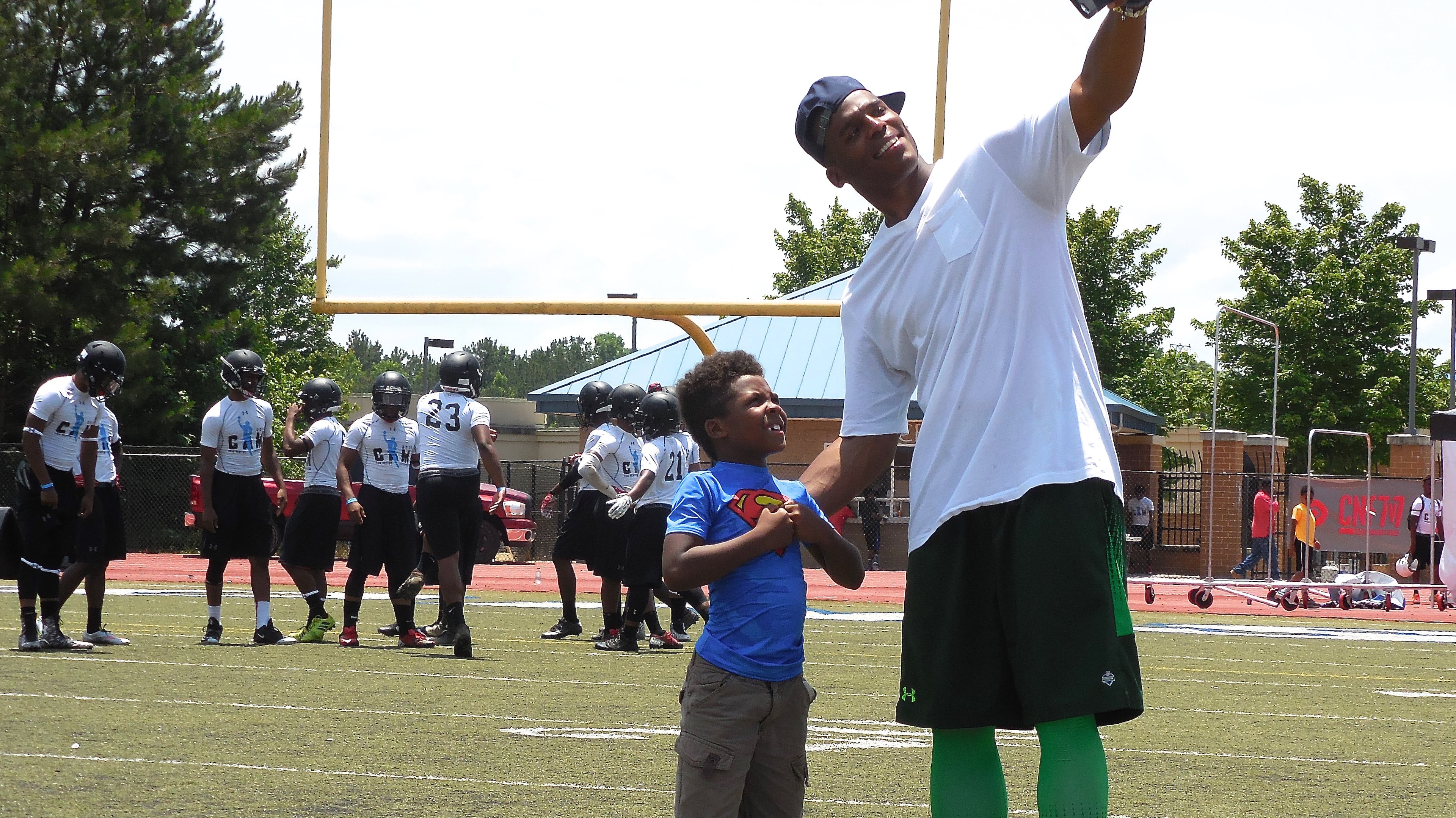 Carolina Panthers QB and Westlake High School alum Cam Newton poses for a selfie with a young superhero! Photo: Jennifer Brett