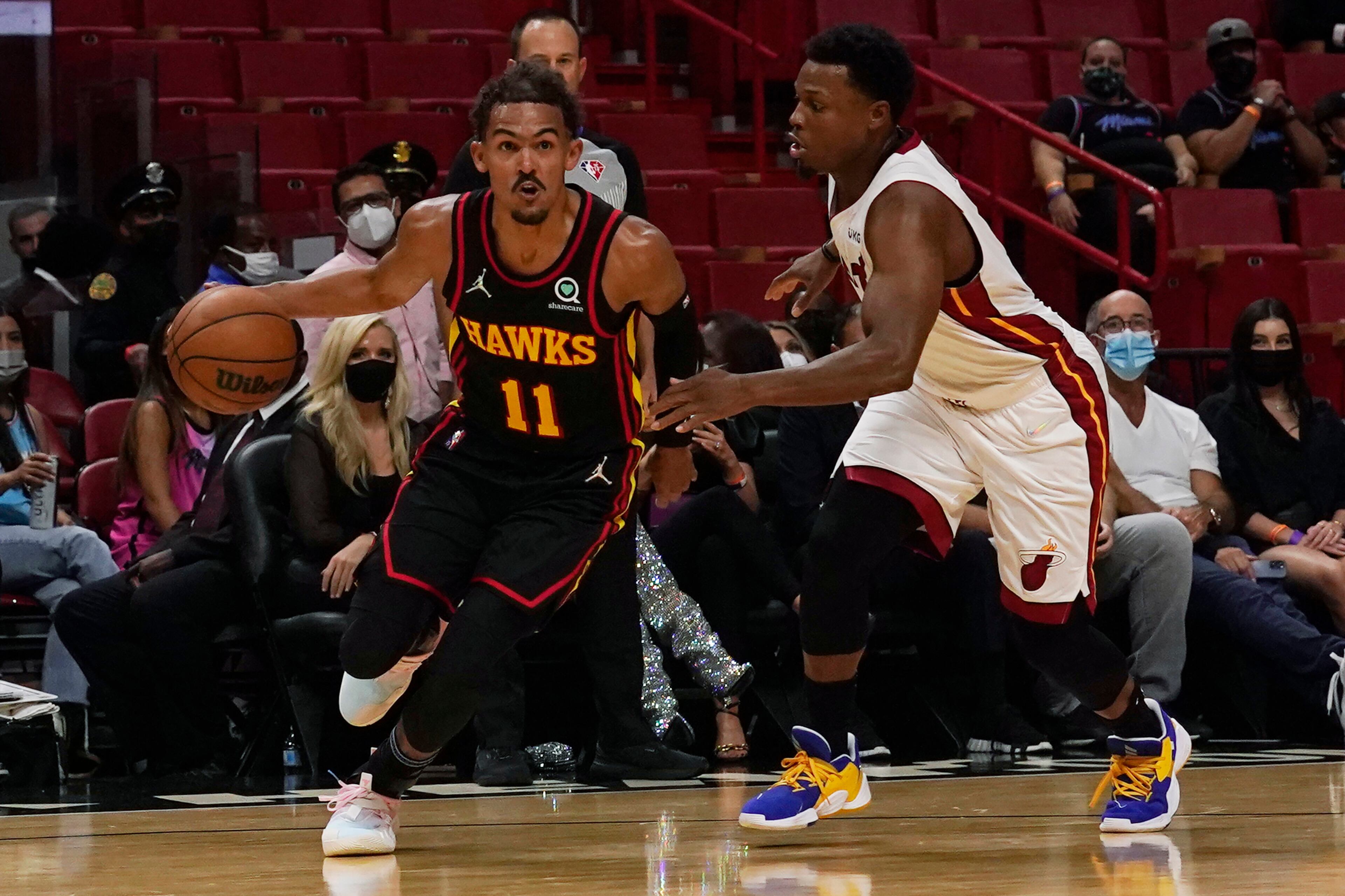 Miami Heat guard Kyle Lowry (7) defends against Hawks guard Trae Young (11) during the first half of a preseason NBA game, Monday, Oct. 4, 2021, in Miami. (Marta Lavandier/AP)