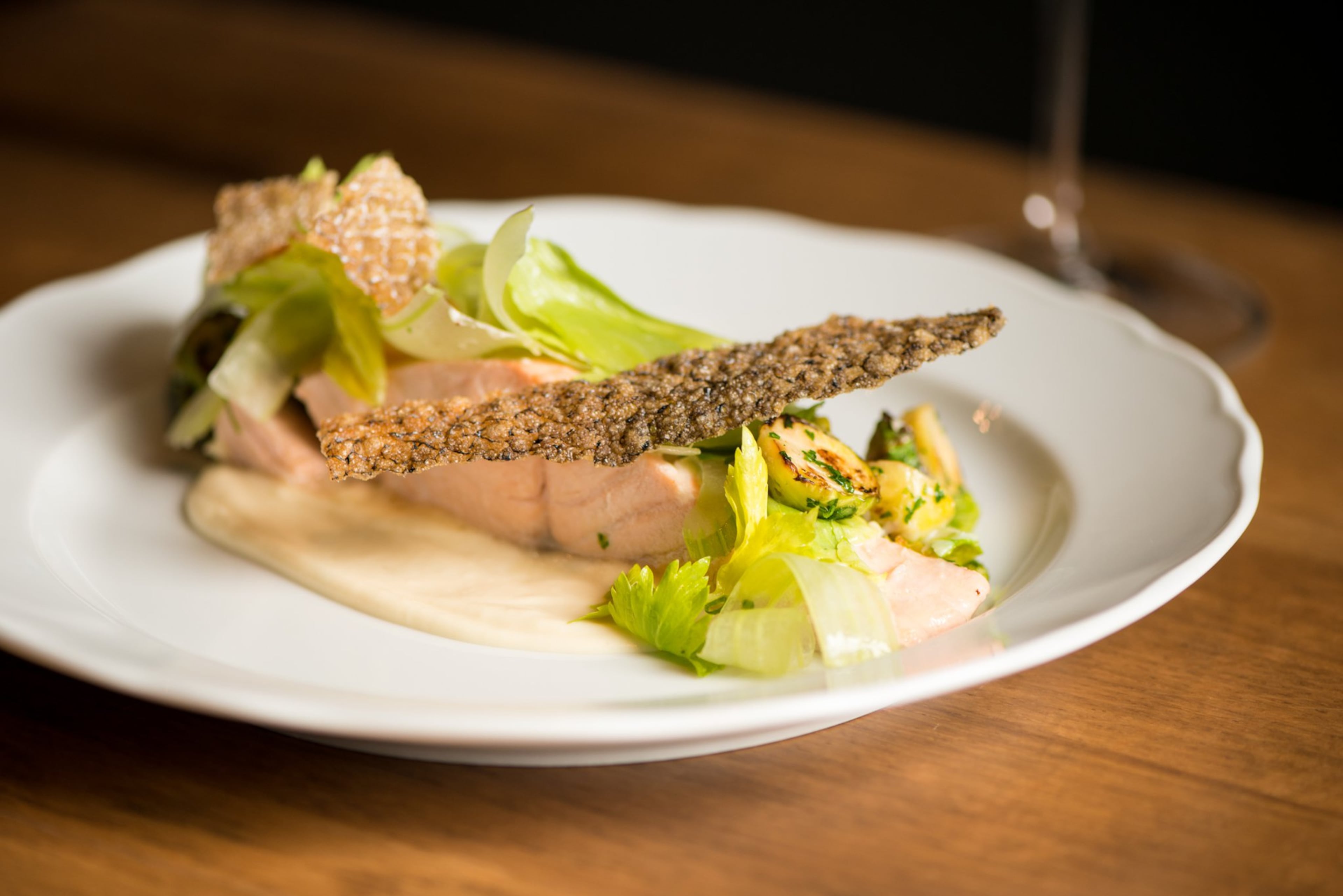 Achie's Poached Salmon with crisp skin, Brussels, lemon emulsion, whipped celery root, pickled celery. Photo credit- Mia Yakel.