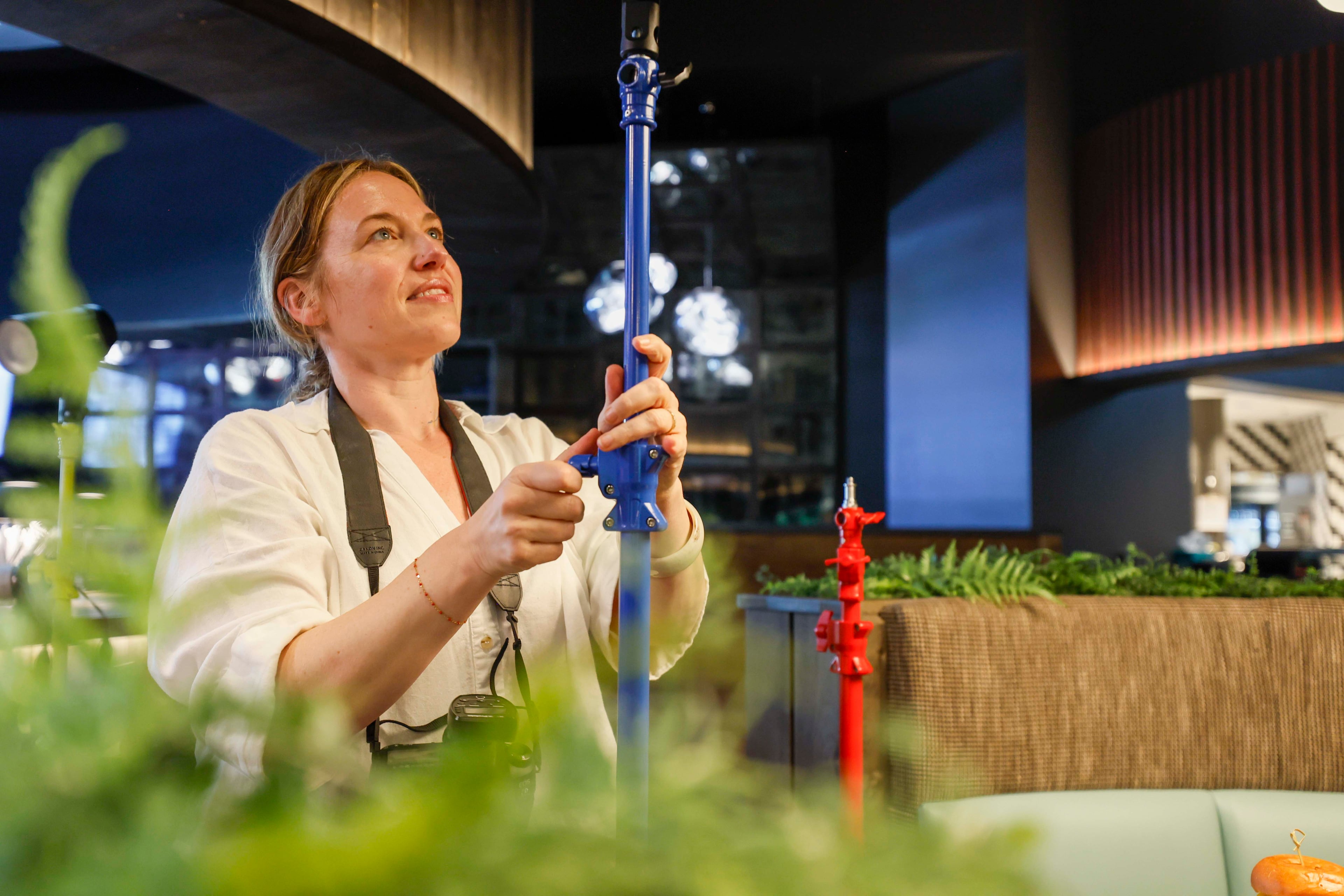 Harris hopes her colorful light stands will help other photographers bring more personality to their work. (Miguel Martinez/AJC)