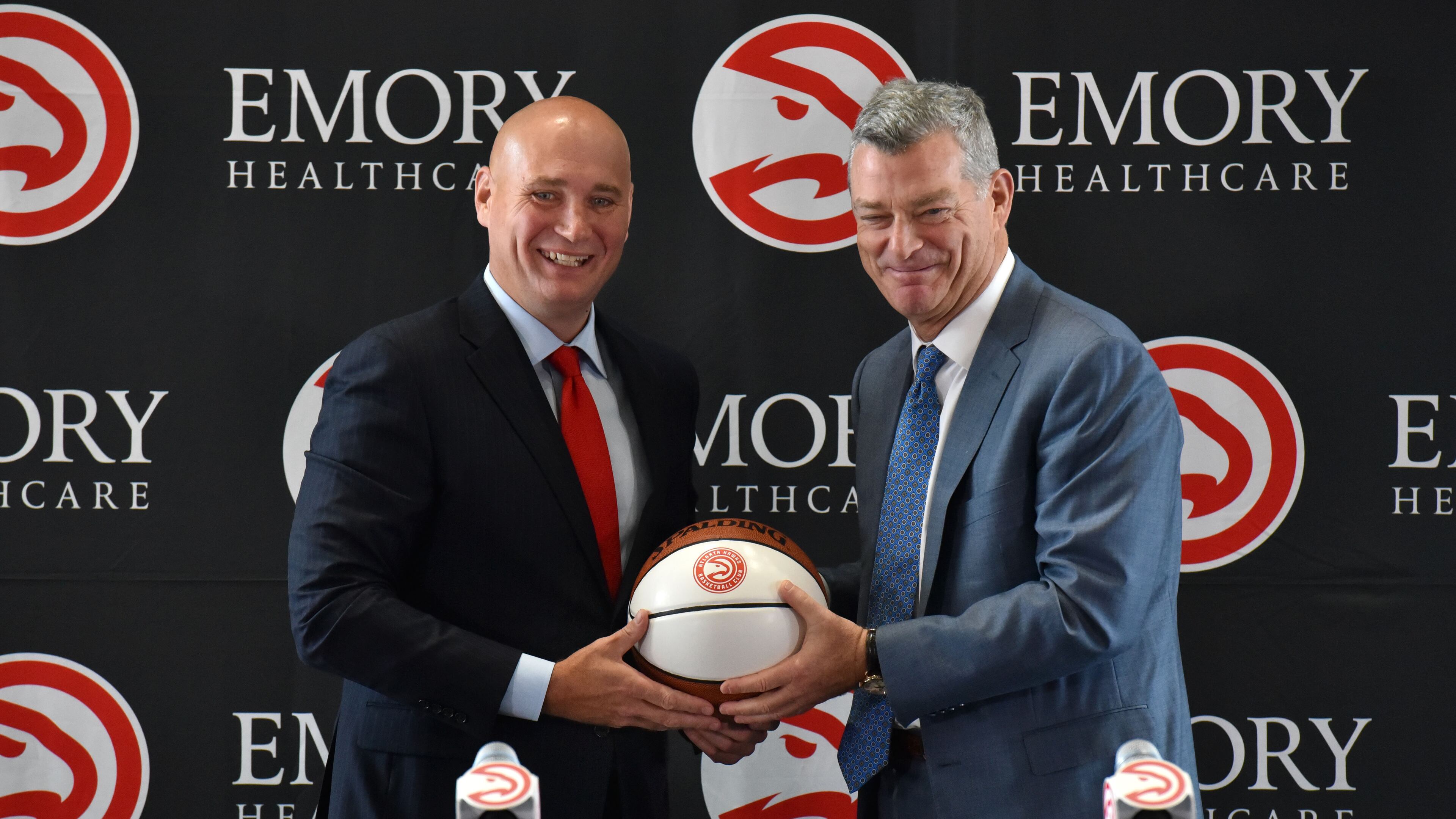 June 2, 2017 Atlanta - New Hawks GM Travis Schlenk (left) and Hawks principal owner Tony Ressler hold a basketball during the press conference to officially introduce new general manager Travis Schlenk at Philips Arena on Friday, June 2, 2017. HYOSUB SHIN / HSHIN@AJC.COM