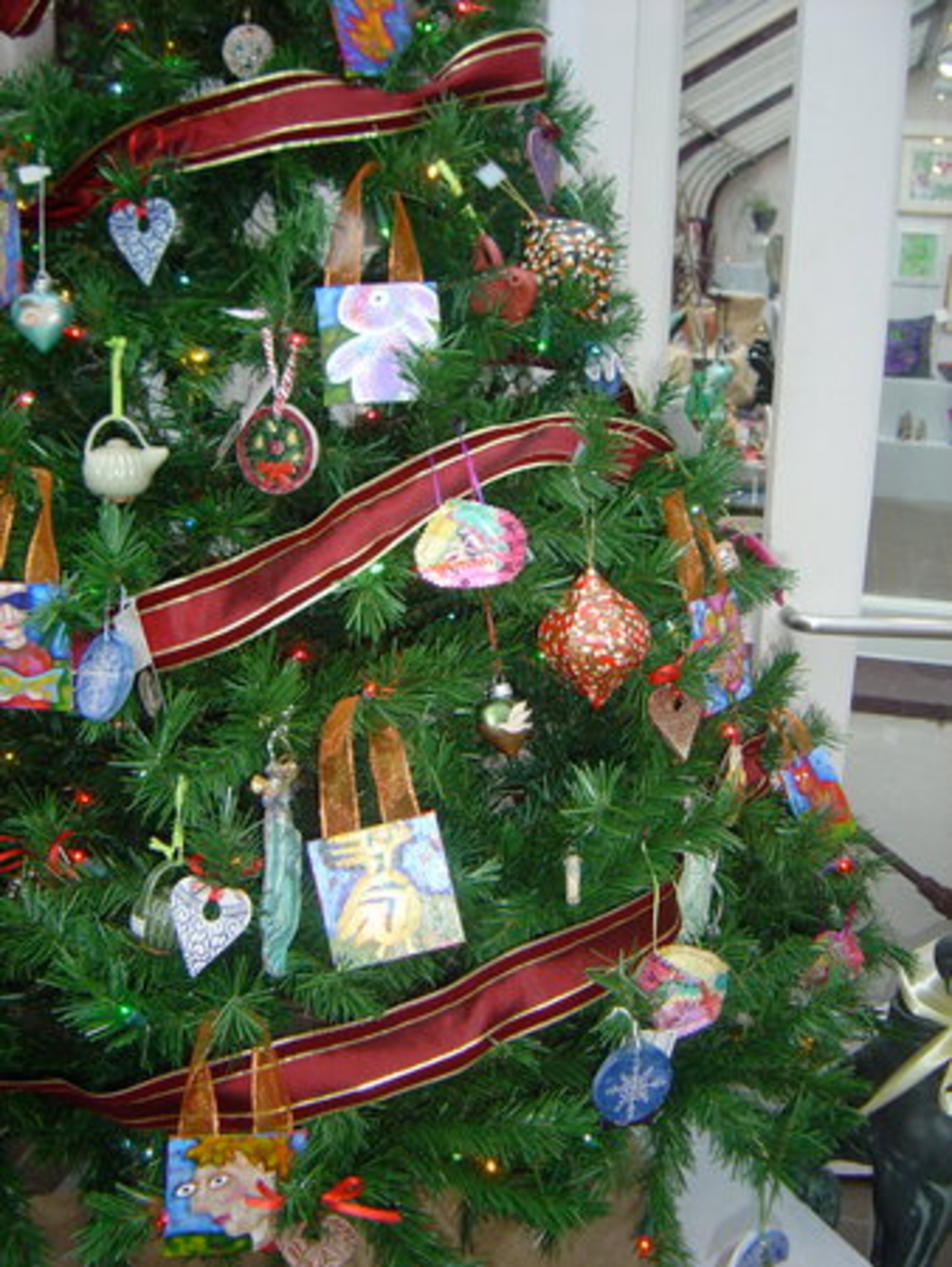Handmade holiday tree ornaments created by Callanwolde artists.