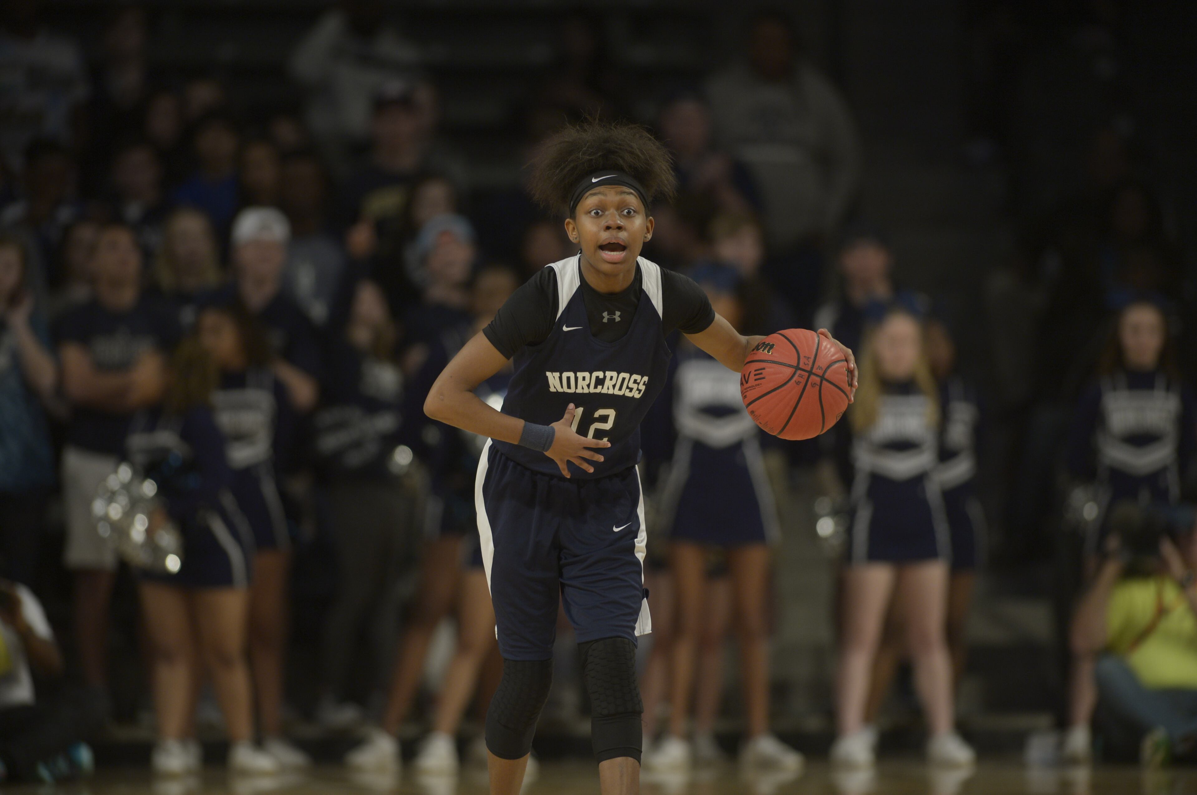Atlanta, Ga. -- Norcross junior Tehya Lyons (12) signals as she brings the ball up court in the first half of her Class AAAAAAA state championship game at Georgia Tech's McCamish Pavillion Friday, March 10, 2017. SPECIAL/Daniel Varnado
