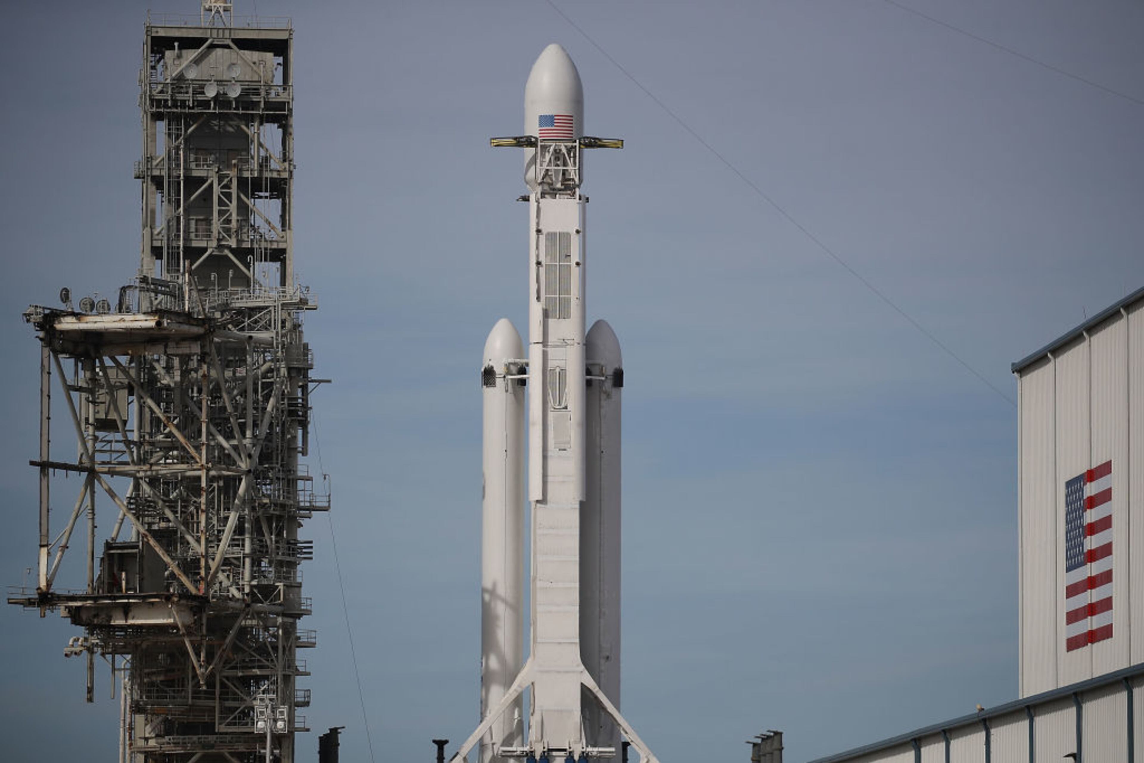 CAPE CANAVERAL, FL - FEBRUARY 05: The SpaceX Falcon Heavy rocket sits on launch pad 39A at Kennedy Space Center as it is prepared for tomorrow's lift-off on February 5, 2018 in Cape Canaveral, Florida. The rocket, which is the most powerful rocket in the world, is scheduled to make its maiden flight between 1:30 and 4:30 p.m. tomorrow. (Photo by Joe Raedle/Getty Images)