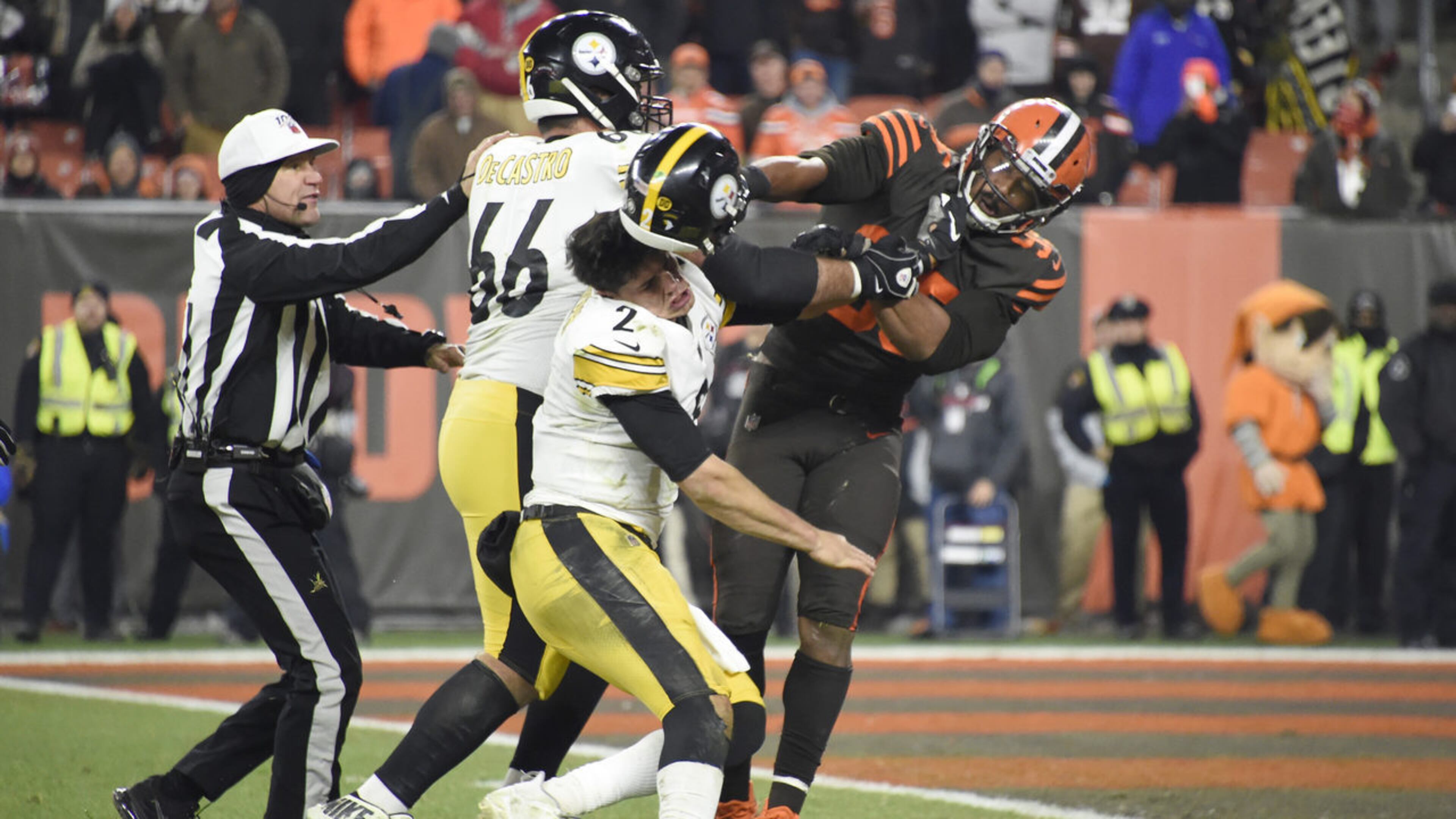 Quarterback Mason Rudolph of the Pittsburgh Steelers fights with defensive end Myles Garrett of the Cleveland Browns during the second half at FirstEnergy Stadium on Nov. 14, 2019, in Cleveland, Ohio.