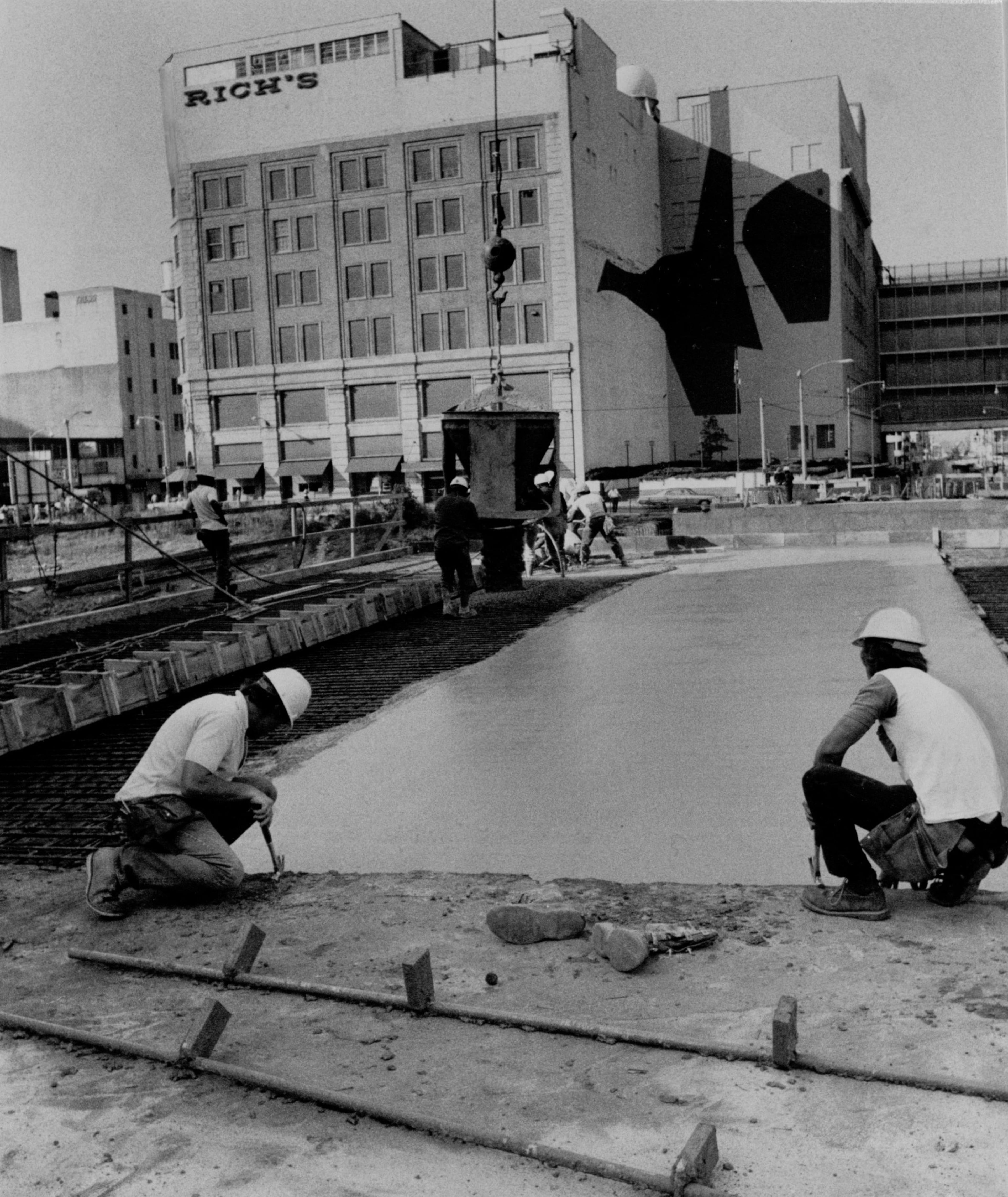 Construction workers pouring concrete at a MARTA construction site, August 12, 1976. Bill wilson/AJC