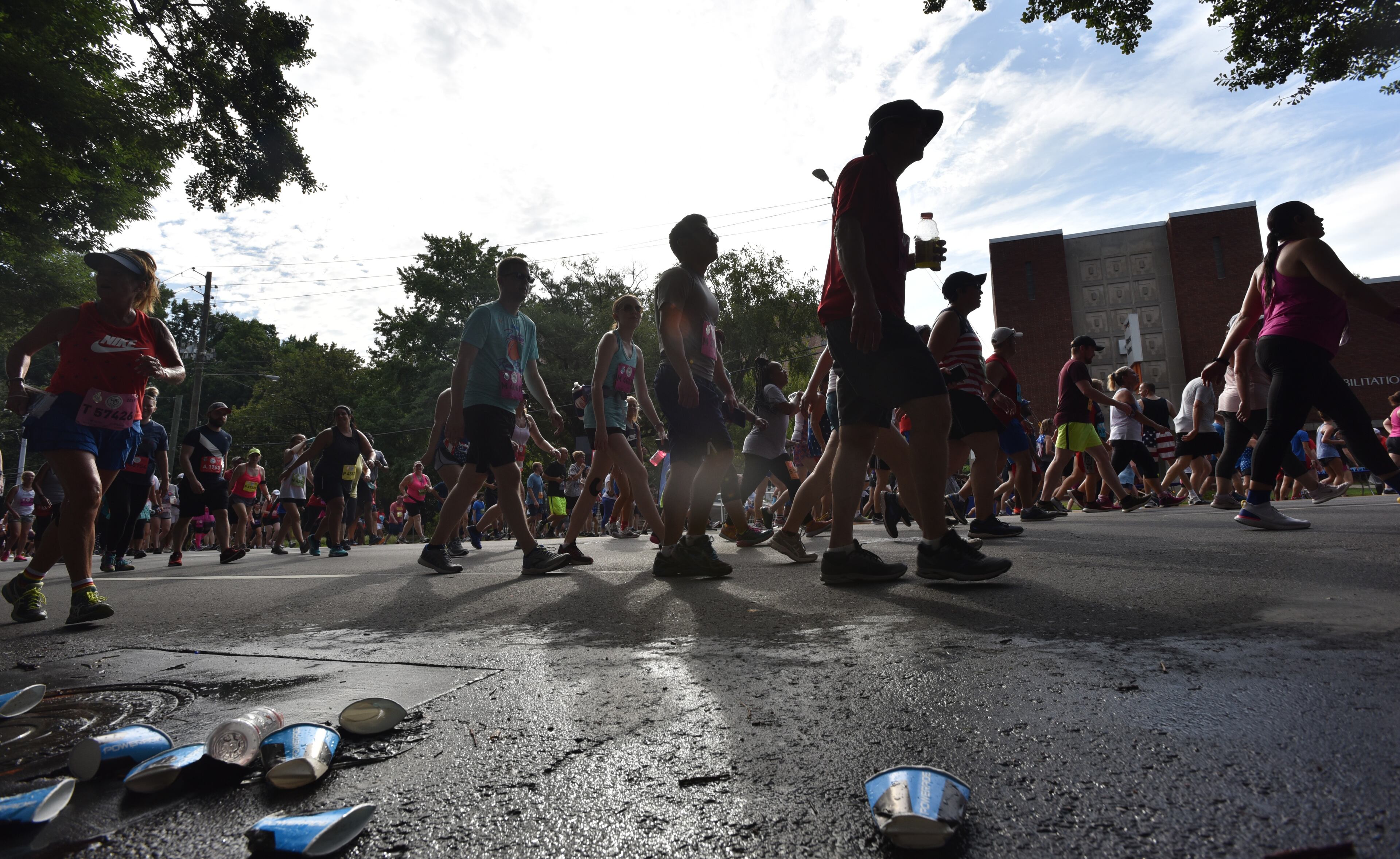 Runners make their way down Peachtree Road during the 50th AJC Peachtree Road Race on Thursday, July 4, 2019. (Hyosub Shin / Hyosub.Shin@ajc.com)