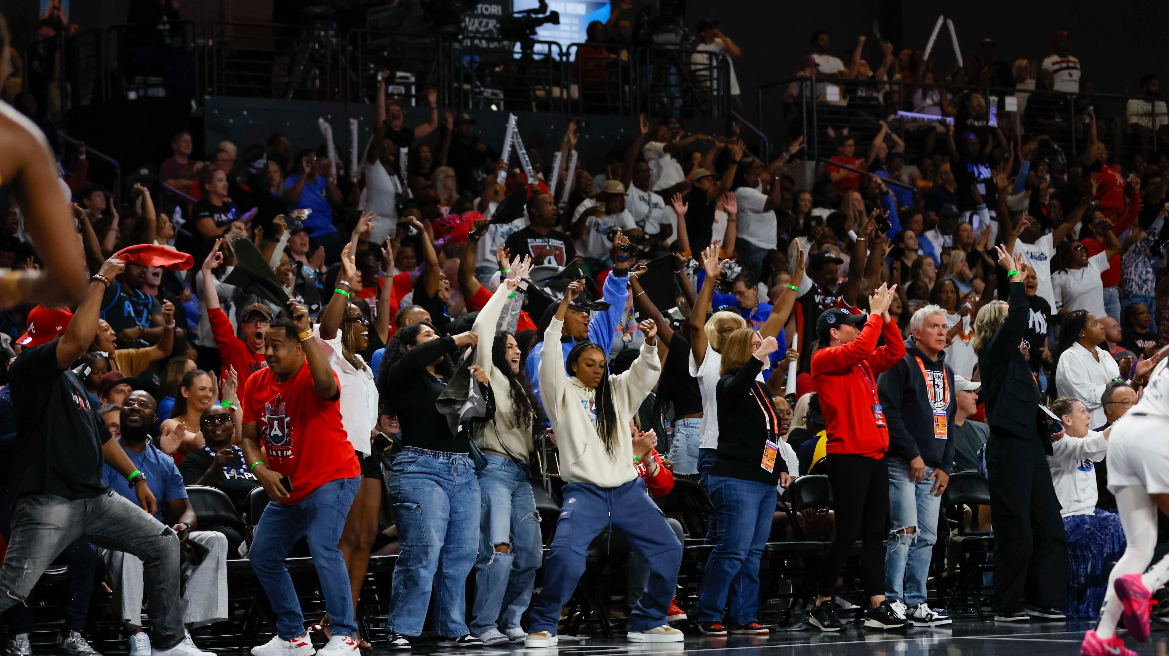 Atlanat Dream fans rectas after a three pointer during the first half of a WNBA first-round playoff game against the Indiana Fever at Gateway Center Arena on Thursday, Sept. 18, 2024, in Atlanta. (Miguel Martinez/ AJC)