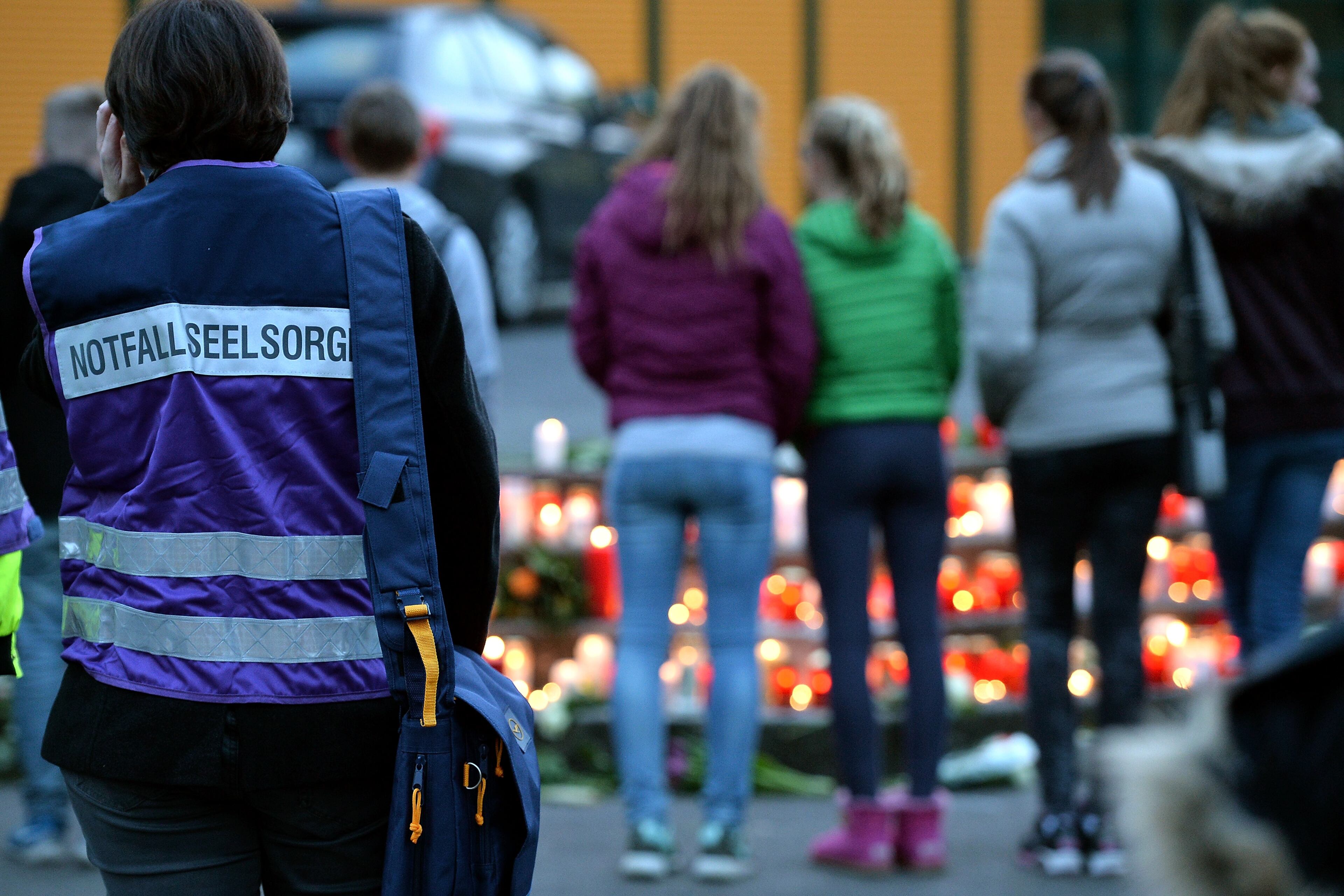 HALTERN AM SEE, GERMANY - MARCH 24: Students and well wishers gather in front of the Joseph-Koenig-Gymnasium secondary school in Haltern am See, Germany on March 24, 2015, from where some of the Germanwings plane crash victims came. Sixteen German teenagers and two teachers on a school exchange trip were assumed to be among the 150 dead in the crash of a passenger jet in the French Alps, officials said. The head of low-budget airline Germanwings said there were 144 passengers and six crew on the Airbus A320 that crashed in the French Alps en route to Duesseldorf from Barcelona. (Photo by Sascha Steinbach/Getty Images)