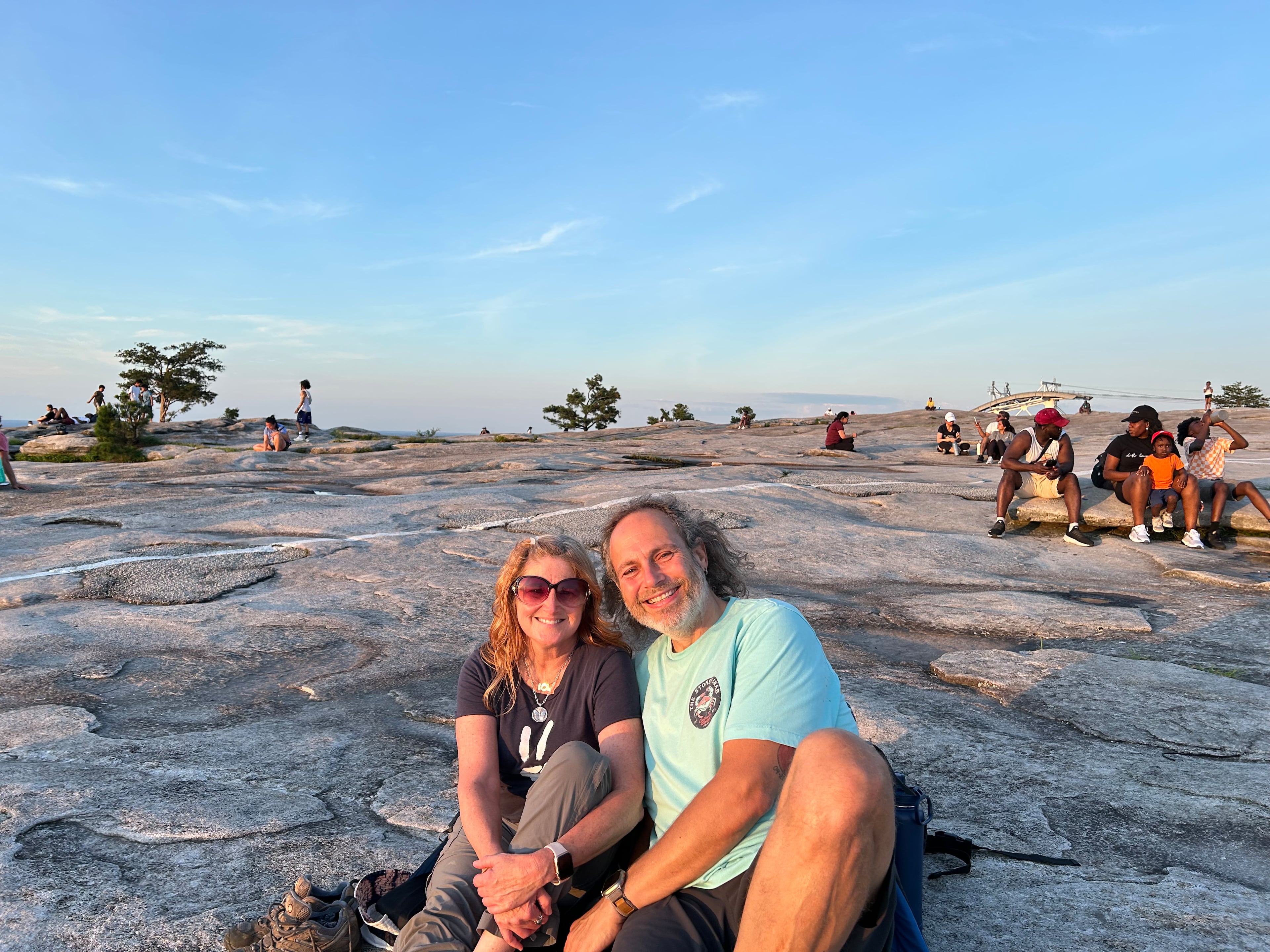 Tamara Hamilton, left, and Jim Ennis spent part of their third date together watching the sunset atop Stone Mountain on Friday, June 20, 2025, the longest day of the year. (Thomas Lake/AJC)