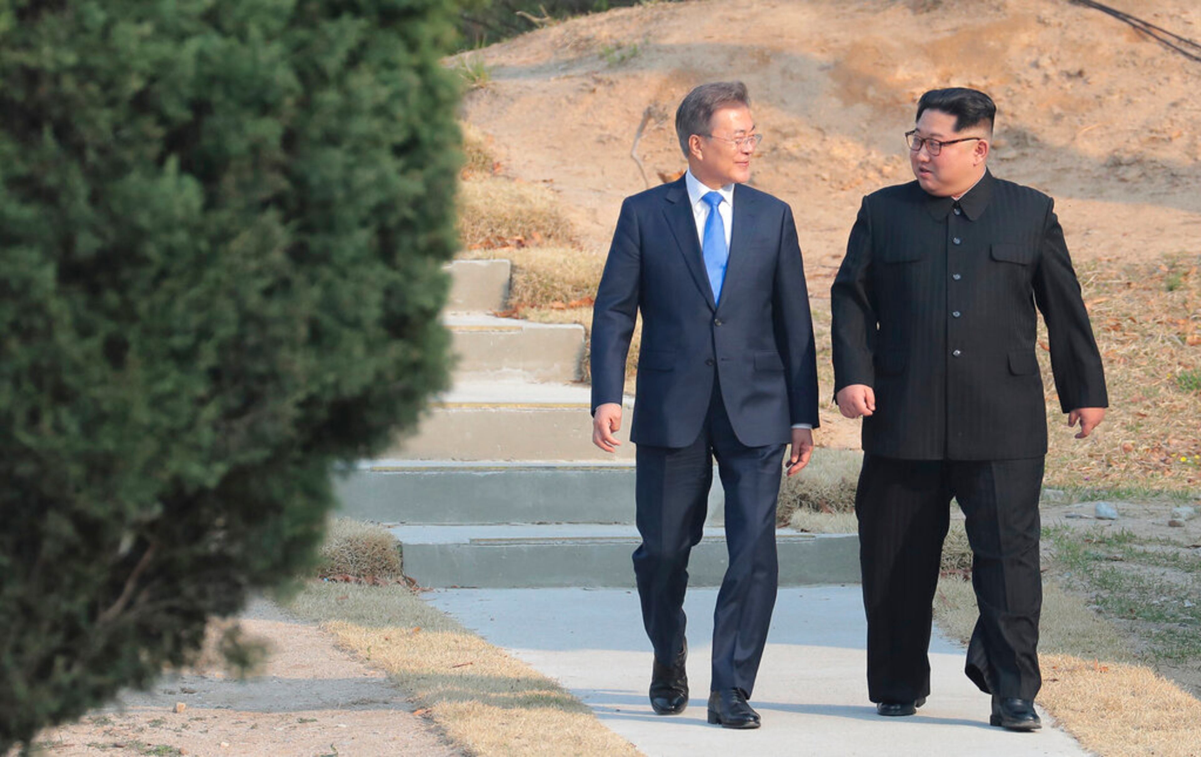FILE - In this April 27, 2018 file photo, North Korean leader Kim Jong Un, right, and South Korean President Moon Jae-in stroll together at the border village of Panmunjom in the Demilitarized Zone, South Korea. North Korea on Saturday, June 13, 2020 again bashed South Korea, telling its rival to stop "nonsensical" talk about its denuclearization and vowing to expand its military capabilities. (Korea Summit Press Pool via AP, File)