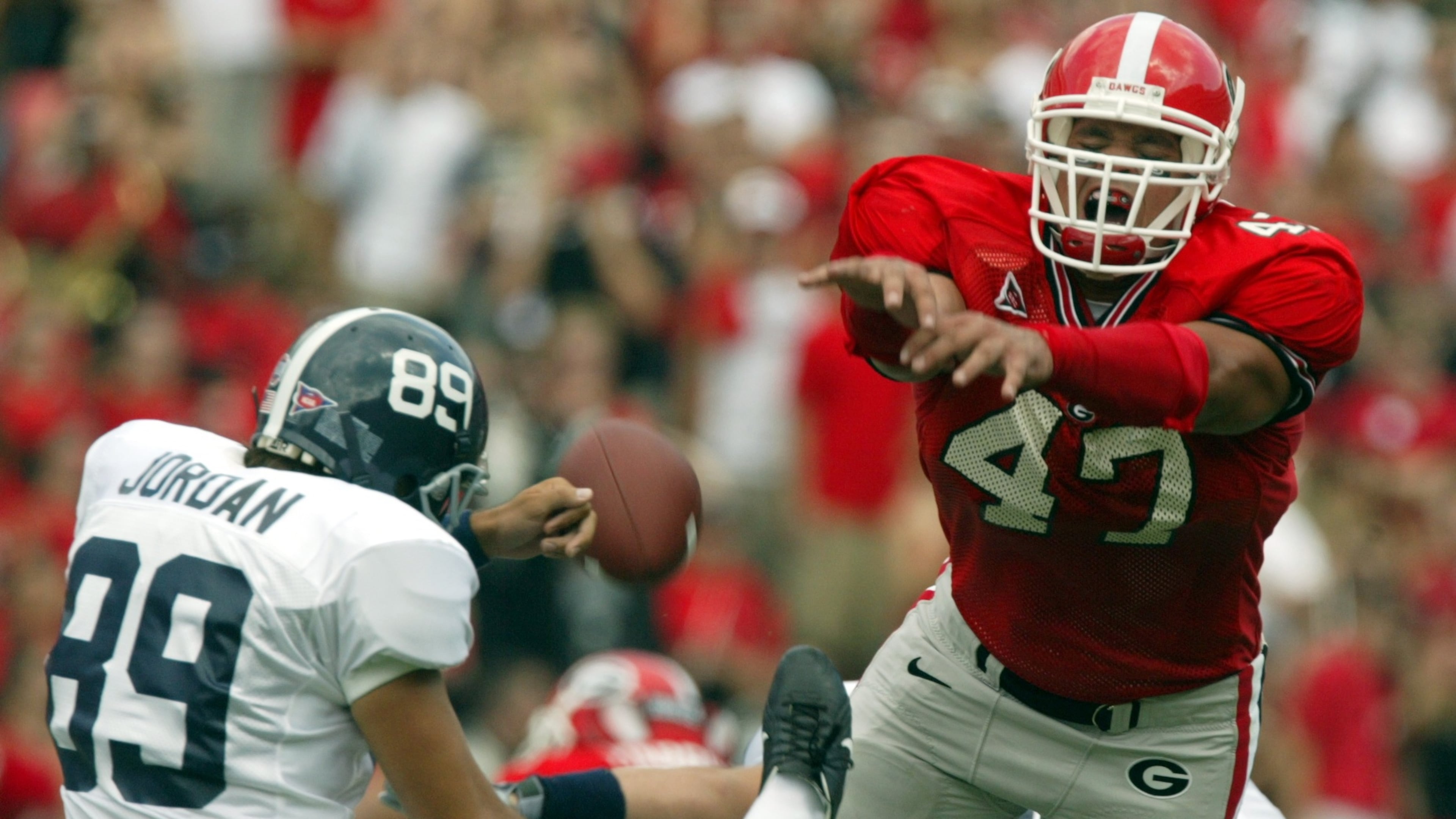 Former UGA football All-American David Pollack (right), who played for the Bulldogs from 2001-2004, will co-own the first Indoor Football League team in Georgia. (Brant Sanderlin/AJC 2004)