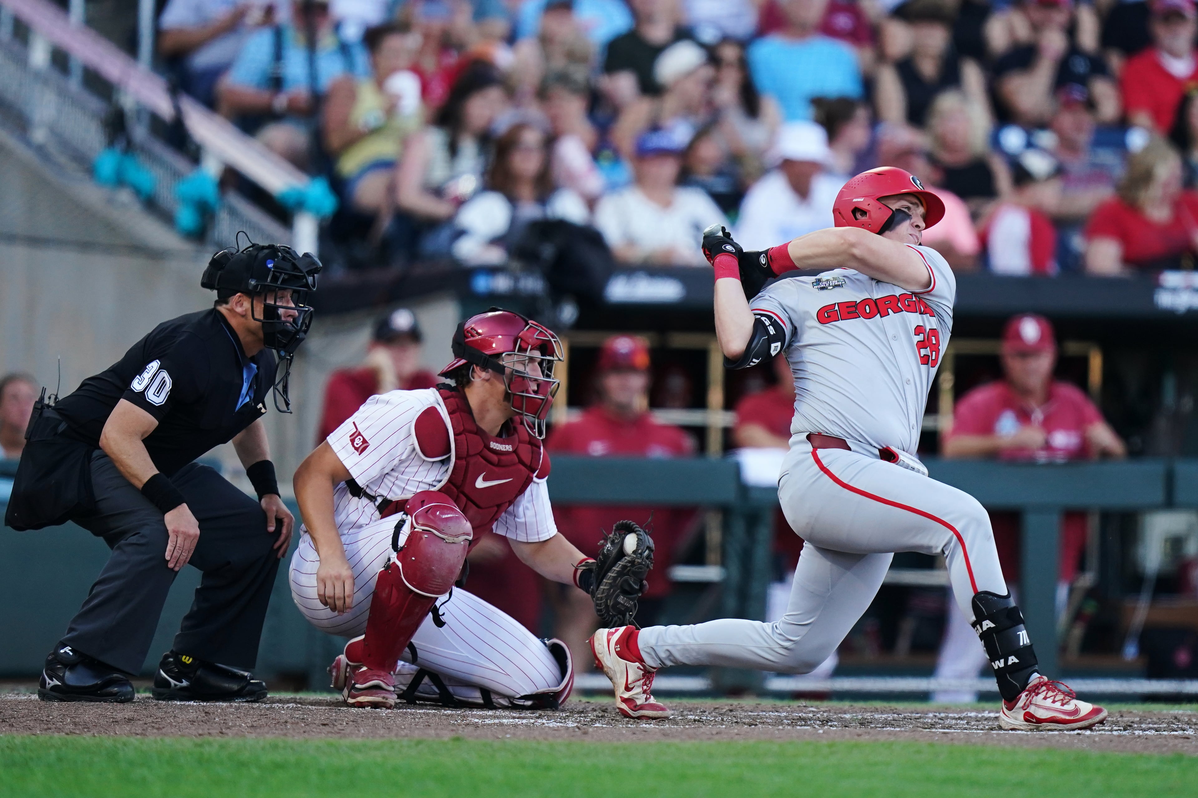 Georgia catcher Brennan Hudson hits a home run during a College World Series game against Oklahoma on Monday, June 15, 2026, in Omaha, Neb. (Vera Nieuwenhuis/AP)