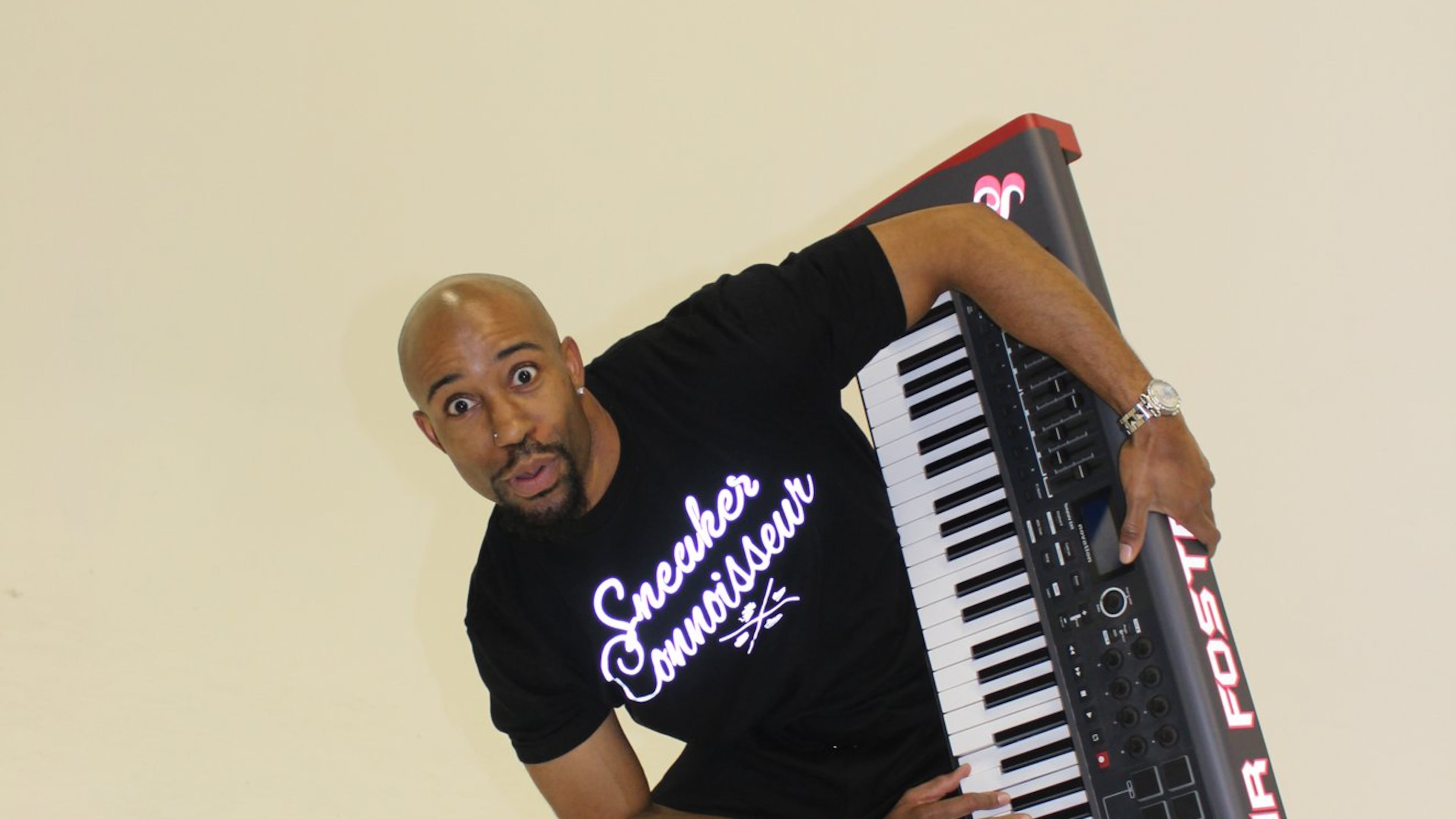 Hawks organist Sir Foster says he knows a couple of thousand songs and always "has one in the chamber." Photo: Melissa Ruggieri/AJC.