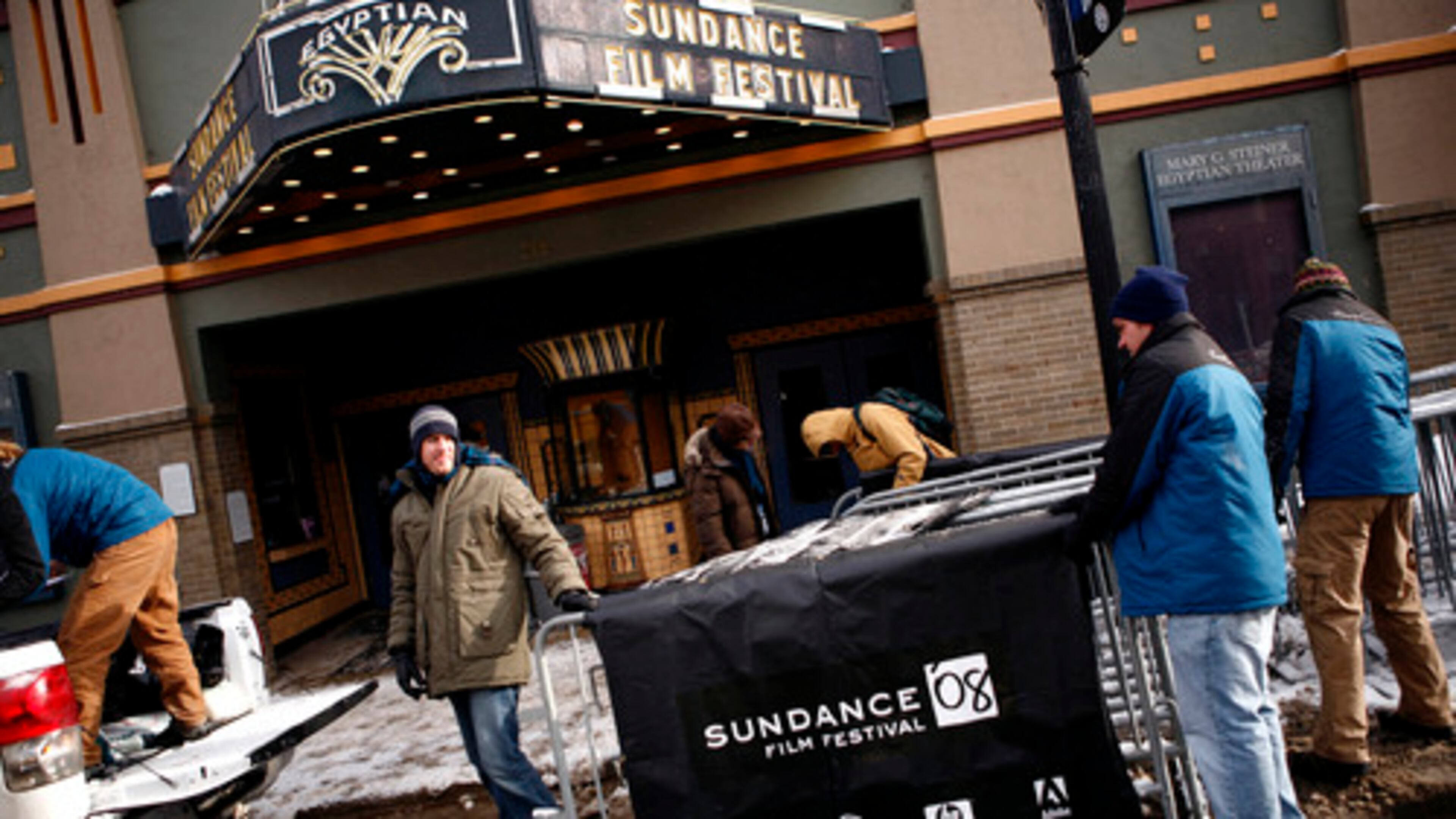 Before the celebrities started rolling in to Park City, Utah, for the Sundance Film Festival, the little town of 7,882 (not counting tourists) began preparations for the Hollywood crush. Here, volunteers hang banners outside Main Street's Egyptian Theater, which will screen some of the festival films. The film fest started Jan. 17 and continues through Jan. 27.