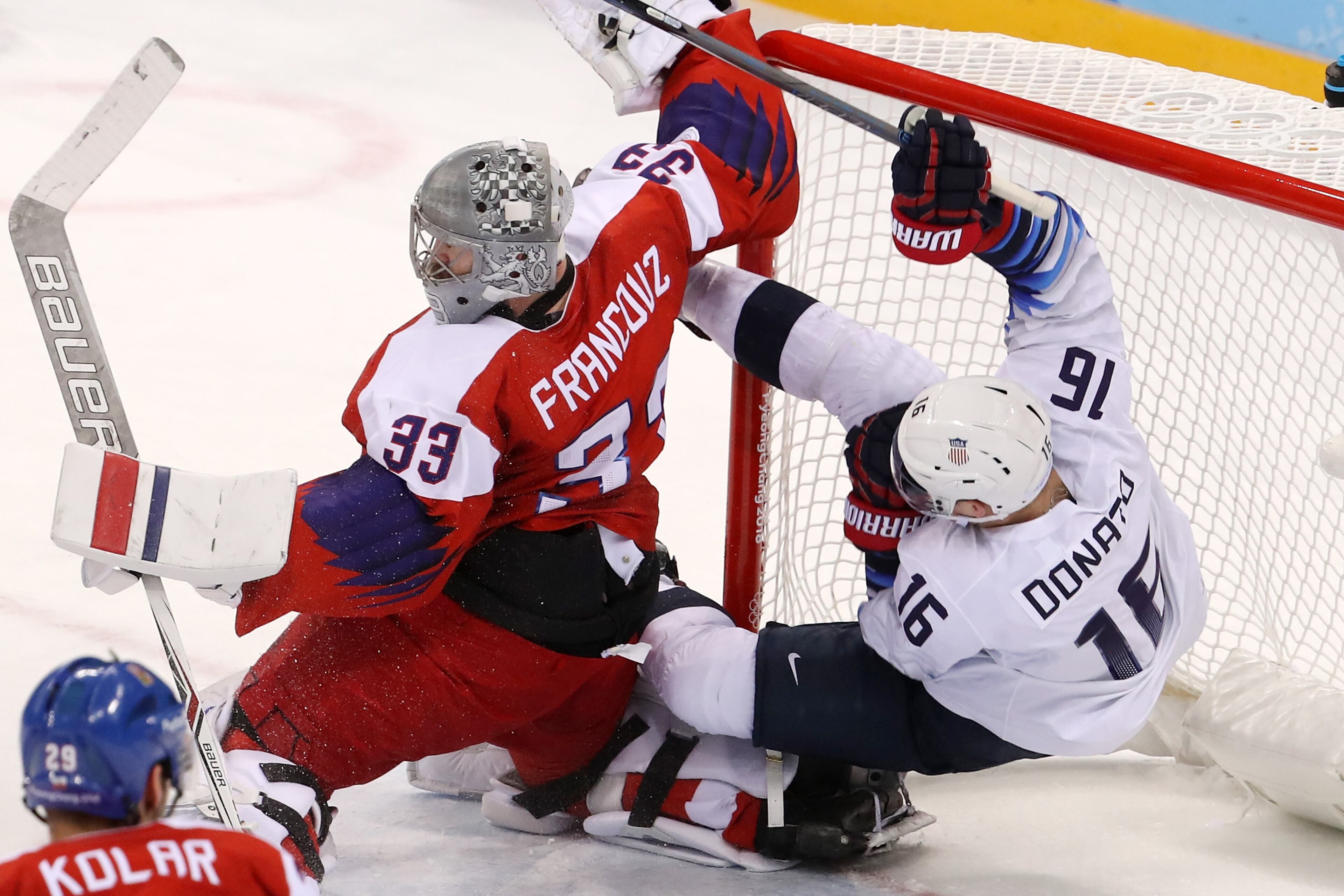 GANGNEUNG, SOUTH KOREA - FEBRUARY 21: Ryan Donato #16 of the United States attempts a shot on Pavel Francouz #33 of the Czech Republic as they collide in overtime during the Men's Play-offs Quarterfinals on day twelve of the PyeongChang 2018 Winter Olympic Games at Gangneung Hockey Centre on February 21, 2018 in Gangneung, South Korea. (Photo by Bruce Bennett/Getty Images)