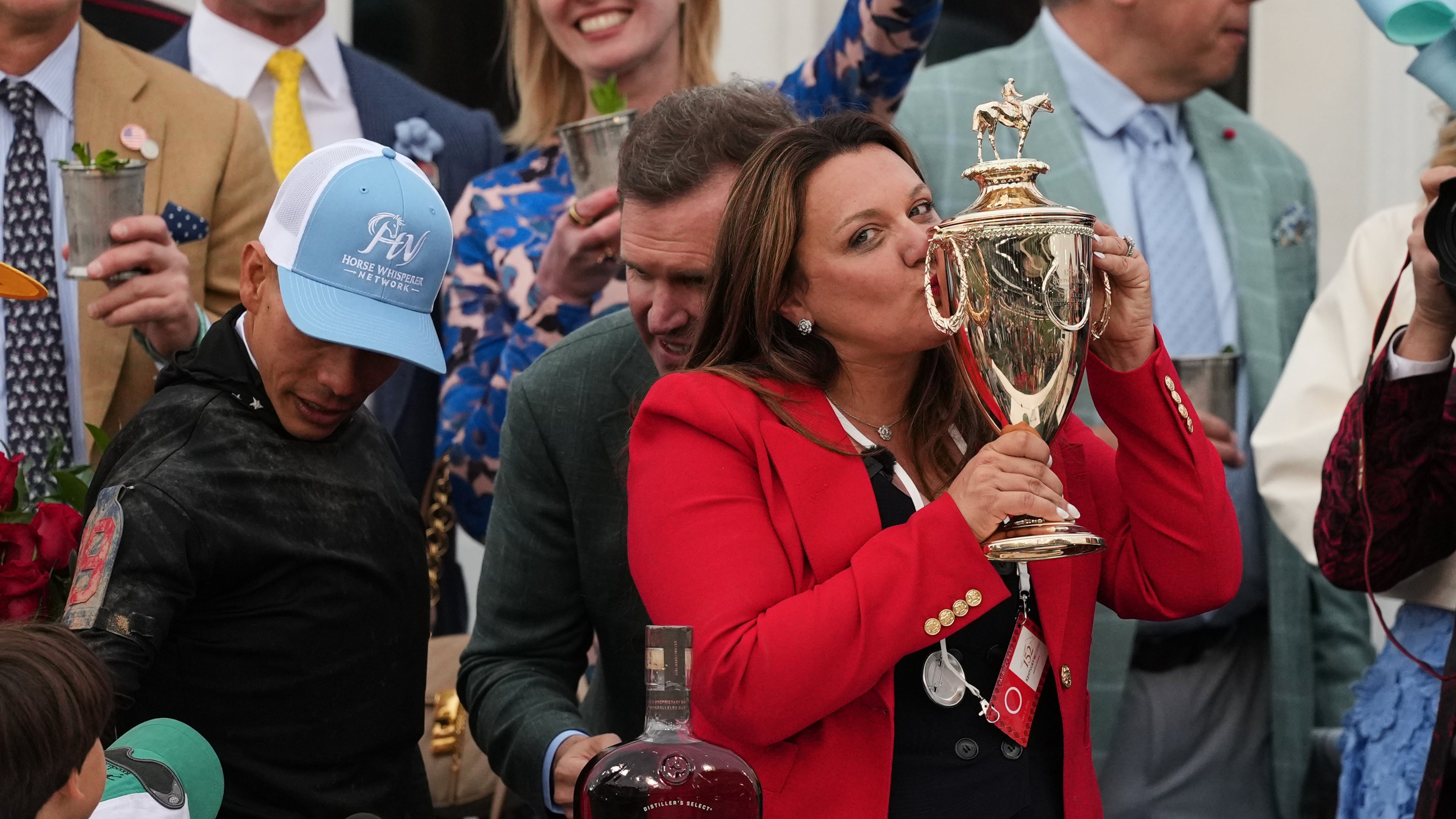 Trainer Cherie DeVaux kisses the trophy after a victory by Golden Tempo in the 152nd running of the Kentucky Derby horse race at Churchill Downs, Saturday, May 2, 2026, in Louisville, Ky. (AP Photo/Abbie Parr)