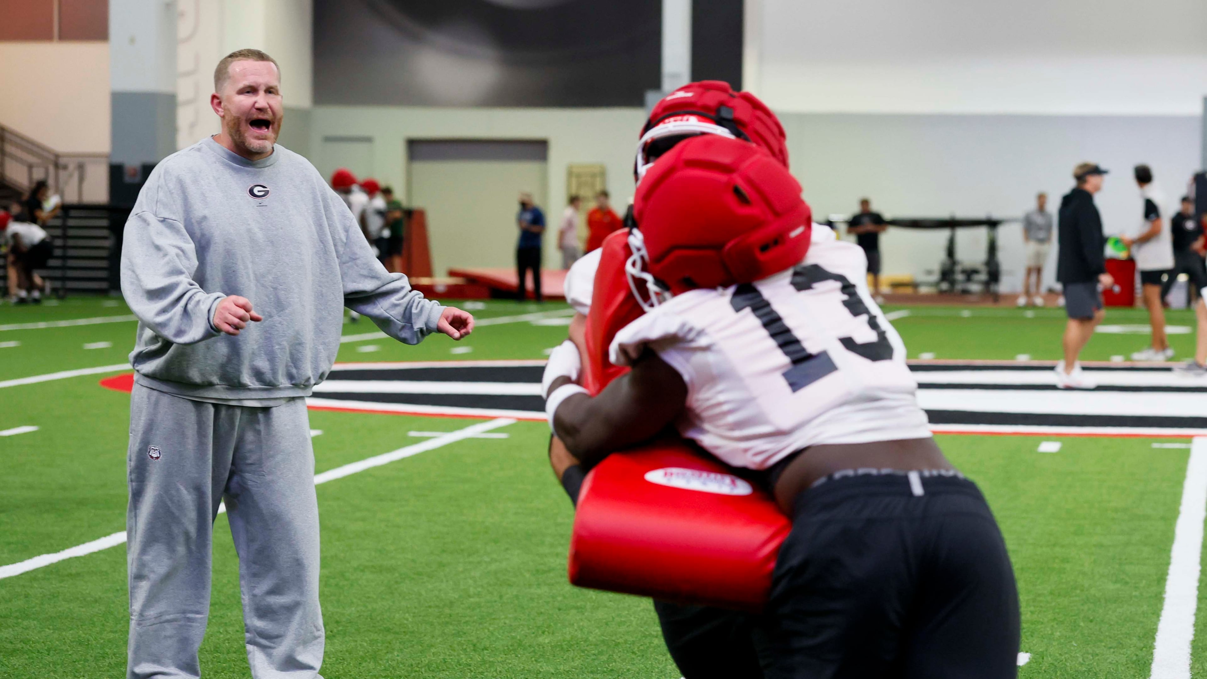 Georgia defensive coordinator Glenn Schumann yells instructions during the Bulldogs' first football practice at the UGA practice facility in Athens on Wednesday, Aug. 5, 2026. (Miguel Martinez/AJC)