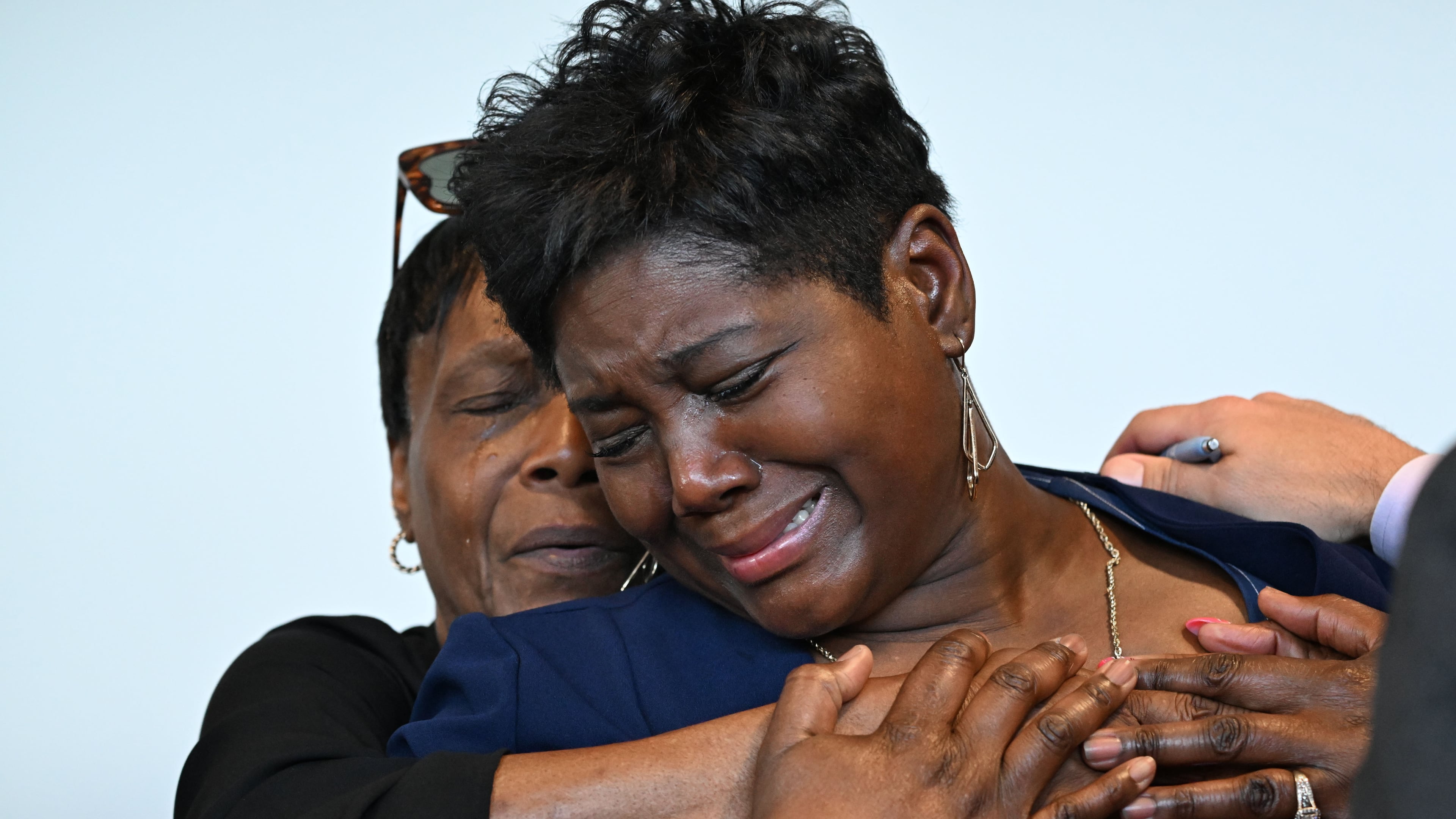 Danyel Smith’s fiancee, LaTasha Pyatt (foreground), becomes emotional following Smith’s bond hearing at Gwinnett County Superior Court on Tuesday, Sept. 1, 2026, in Lawrenceville. Danyel Smith, who was convicted in 2003 in the death of his baby, was recently granted a new trial. (Hyosub Shin/AJC)