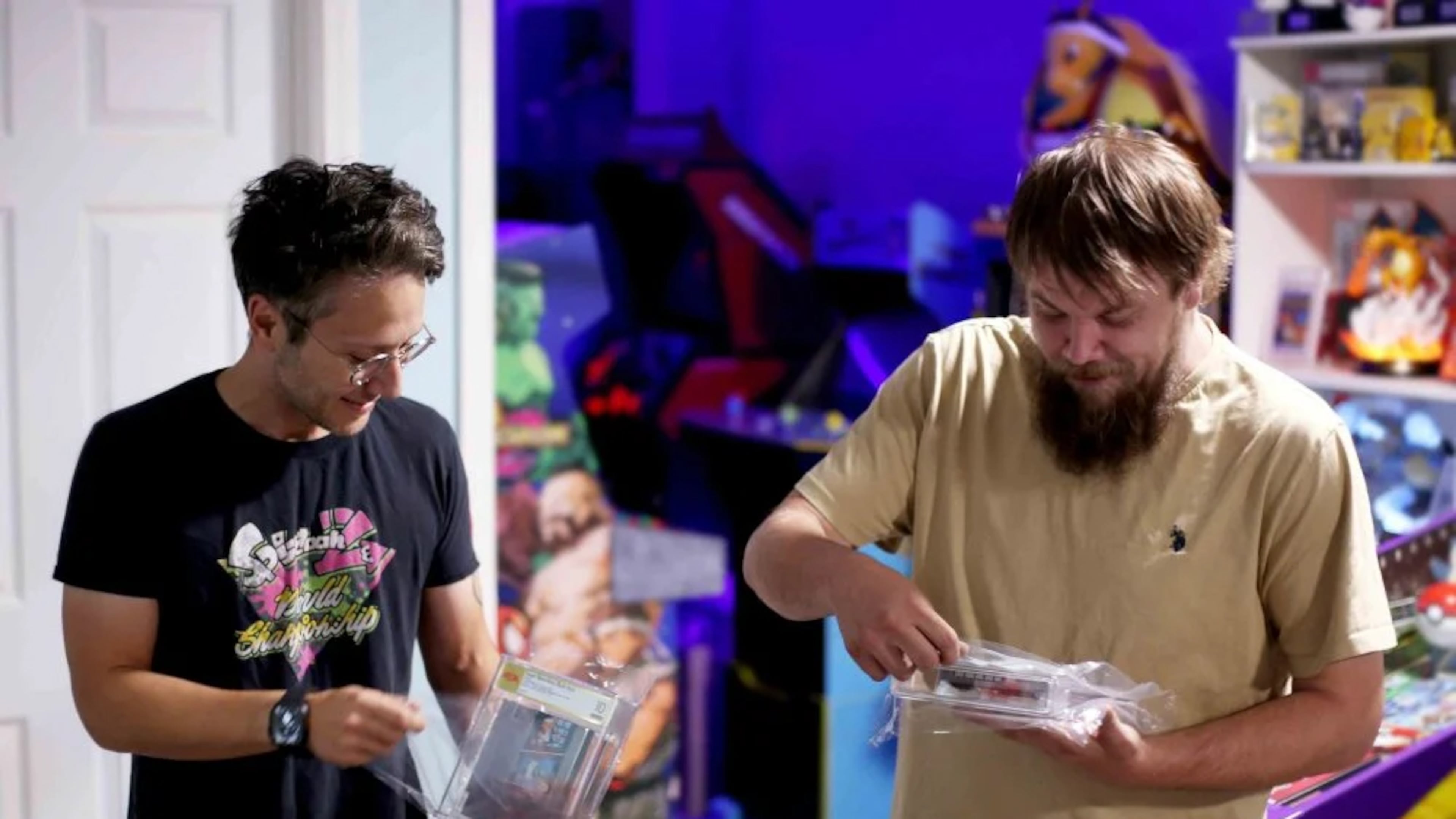 In this photo provided by Nintendo Wire, publisher Jason Ganos, left, and OneStopWonders store owner Kevin Braun hold PSA graded copies of Super Mario Bros. and Duck Hunt video games on Wednesday, June 17, 2026, which they rediscovered in a warehouse in Waukesha, Wis. (Lauren Ganos/Nintendo Wire via AP)