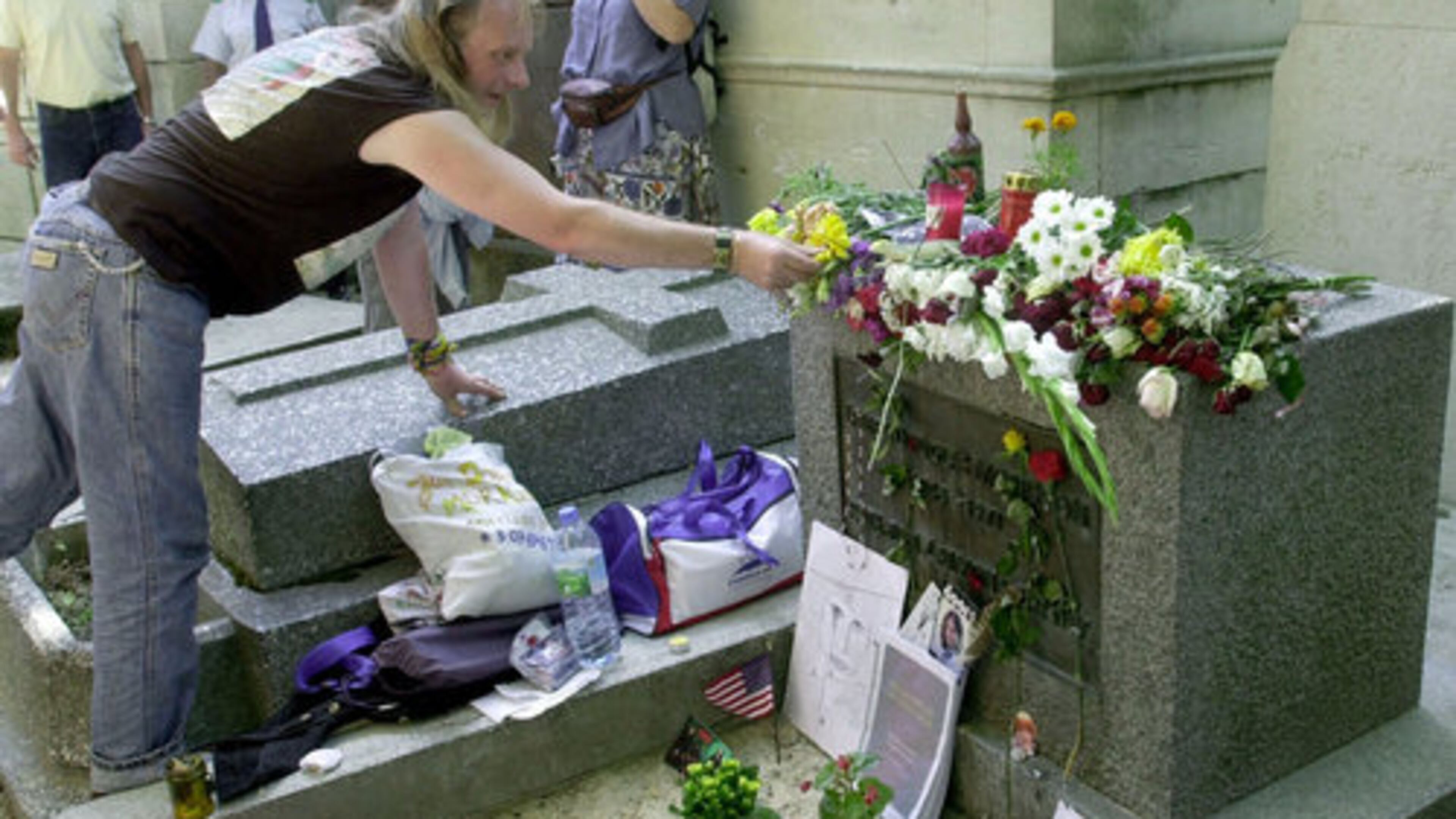 A fan places flowers on Jim Morrison's grave at the Pere Lachaise cemetery in Paris. Patricia Kennealy-Morrison, who wrote about rock when music journalists were just beginning to take it seriously, and through her work met Morrison, frontman of the Doors, with whom she said she had a marriage of sorts, died July 23. She was 75.
