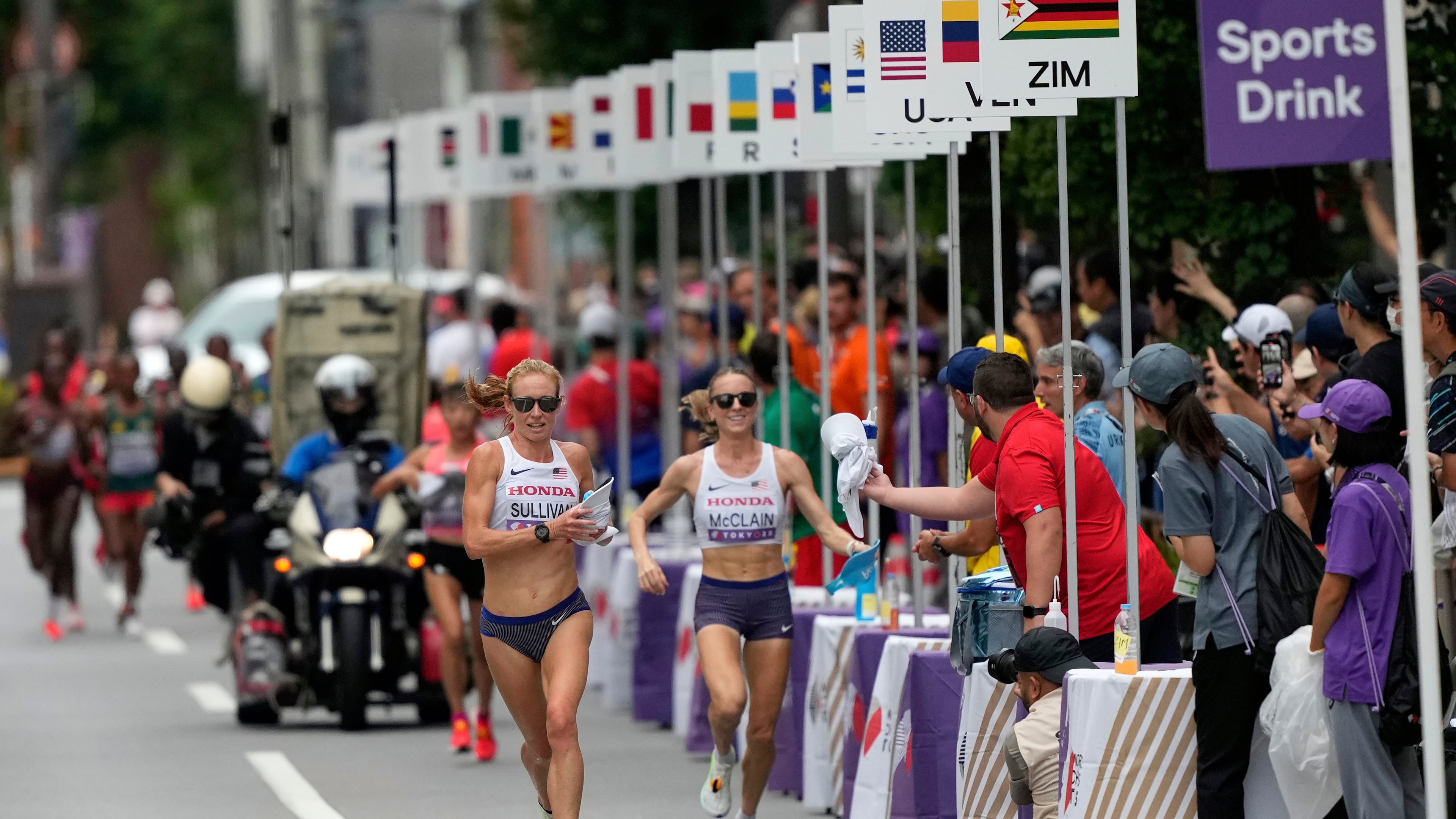 FILE - United States' Susanna Sullivan, left, and United States' Jessica McClain race in the women's marathon at the World Athletics Championships in Tokyo, Sept. 14, 2025. (AP Photo/Hiro Komae, File)