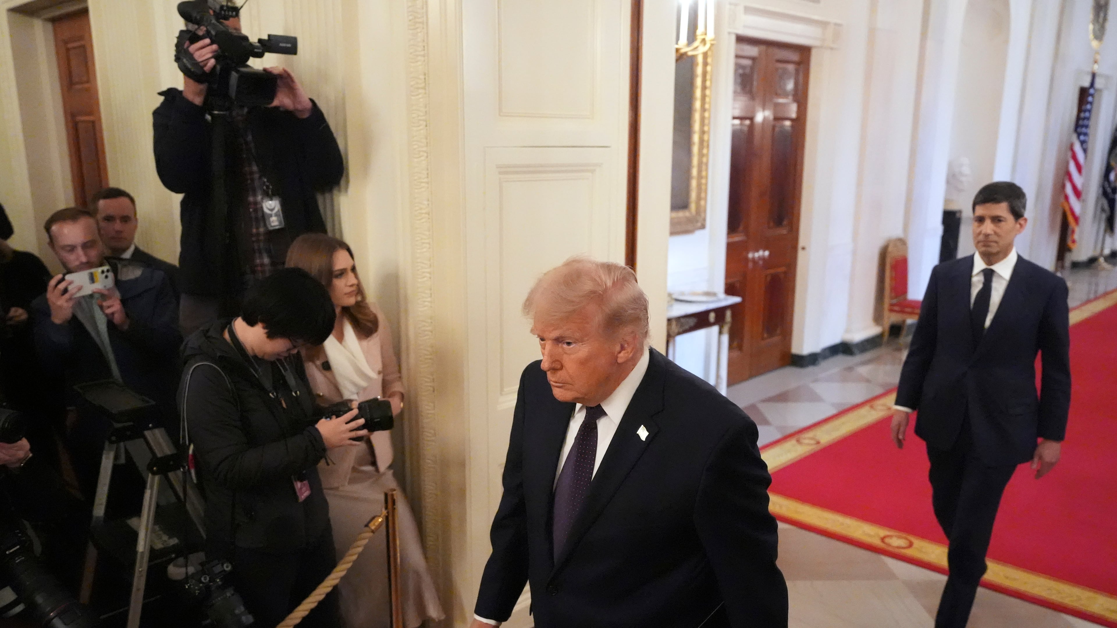 President Donald Trump, left, and Kevin Warsh arrive at a swearing-in ceremony for Warsh as Chairman of the Federal Reserve in the East Room of the White House, Friday, May 22, 2026, in Washington. (AP Photo/Alex Brandon)