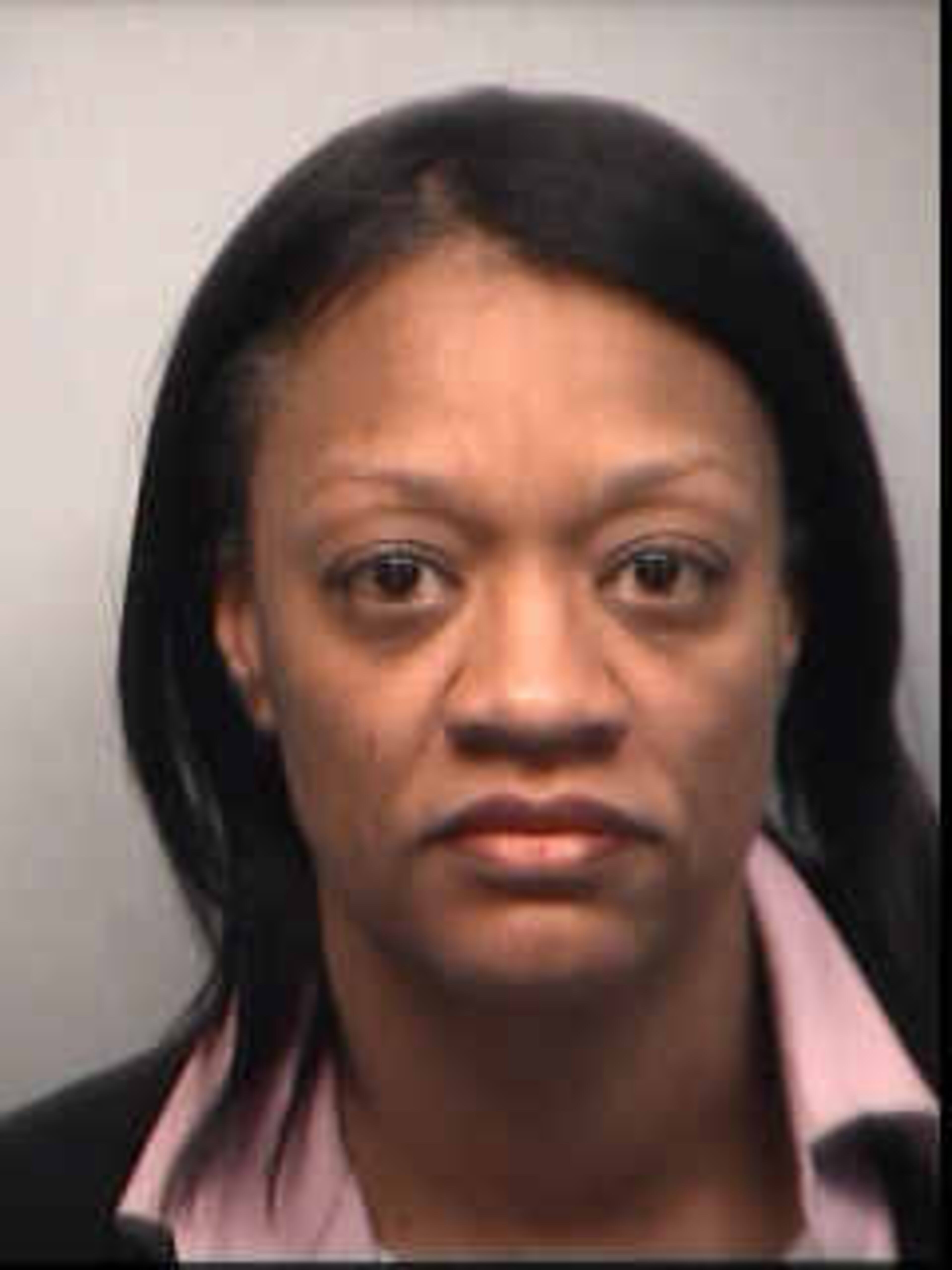 Dana Evans, 46, principal, Dobbs Elementary, was booked into the Fulton County Jail on $100,000 bond, according to jail records. Evans is charged with racketeering, false statements and writings.