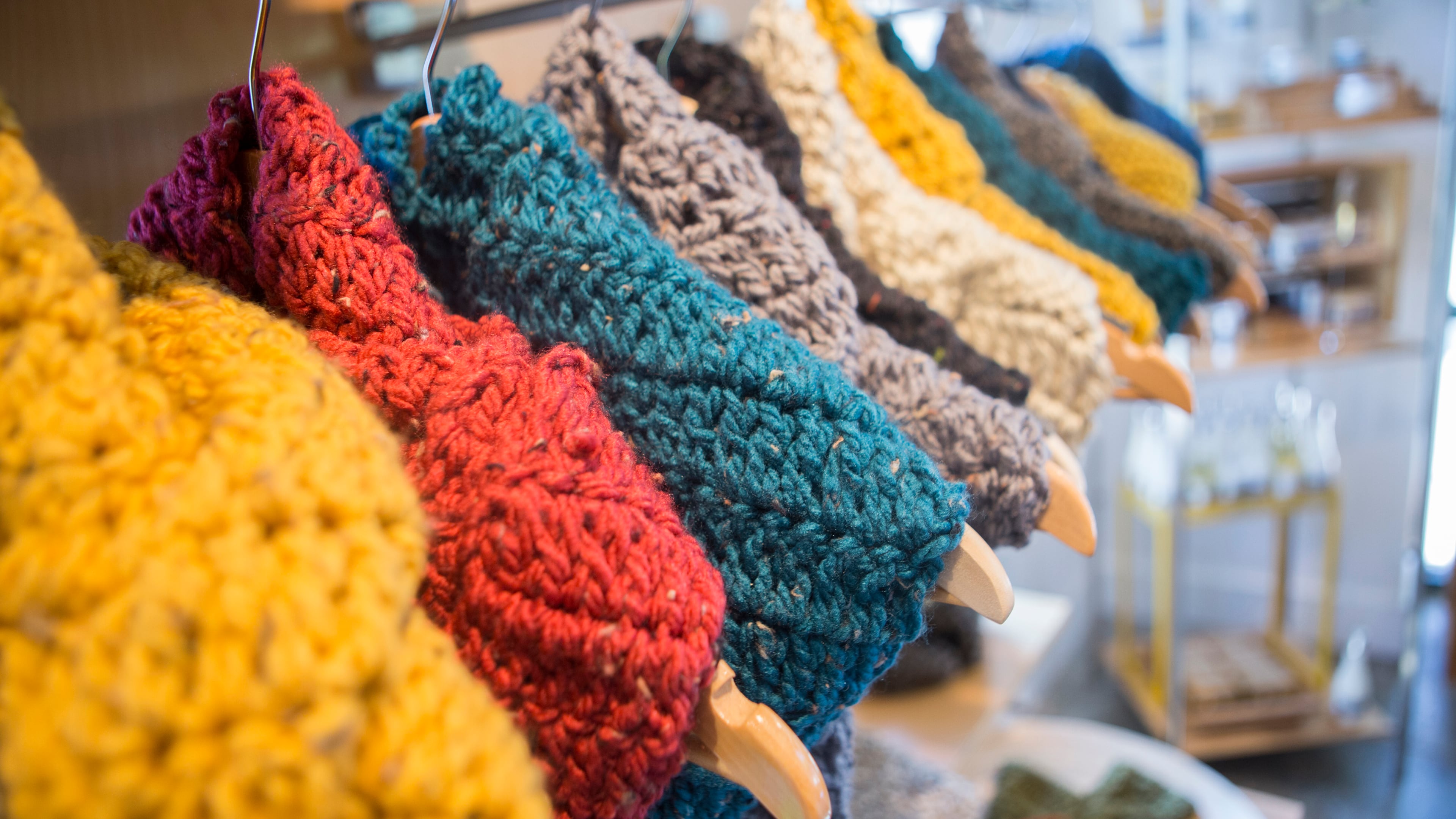 A display of colorful scarves brighten up The Beehive, a store that sells handcrafts and gifts.