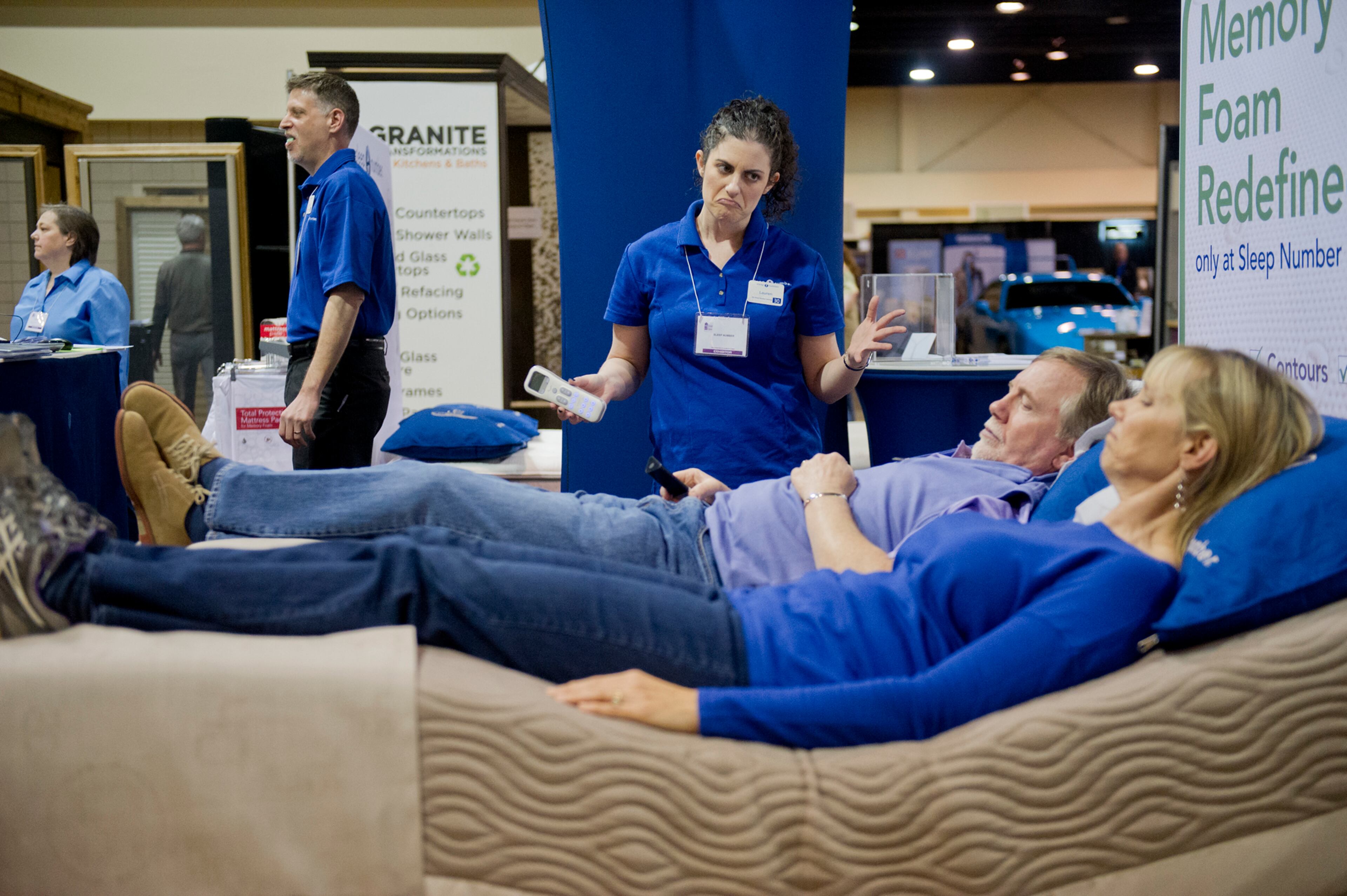Stuart Wilson (center) and his wife Joyce try a display bed as they talk with Lauren Smoller at the North Atlanta Home Show at the Gwinnett Center in Duluth on Sunday, Feb. 23, 2014. JONATHAN PHILLIPS / SPECIAL