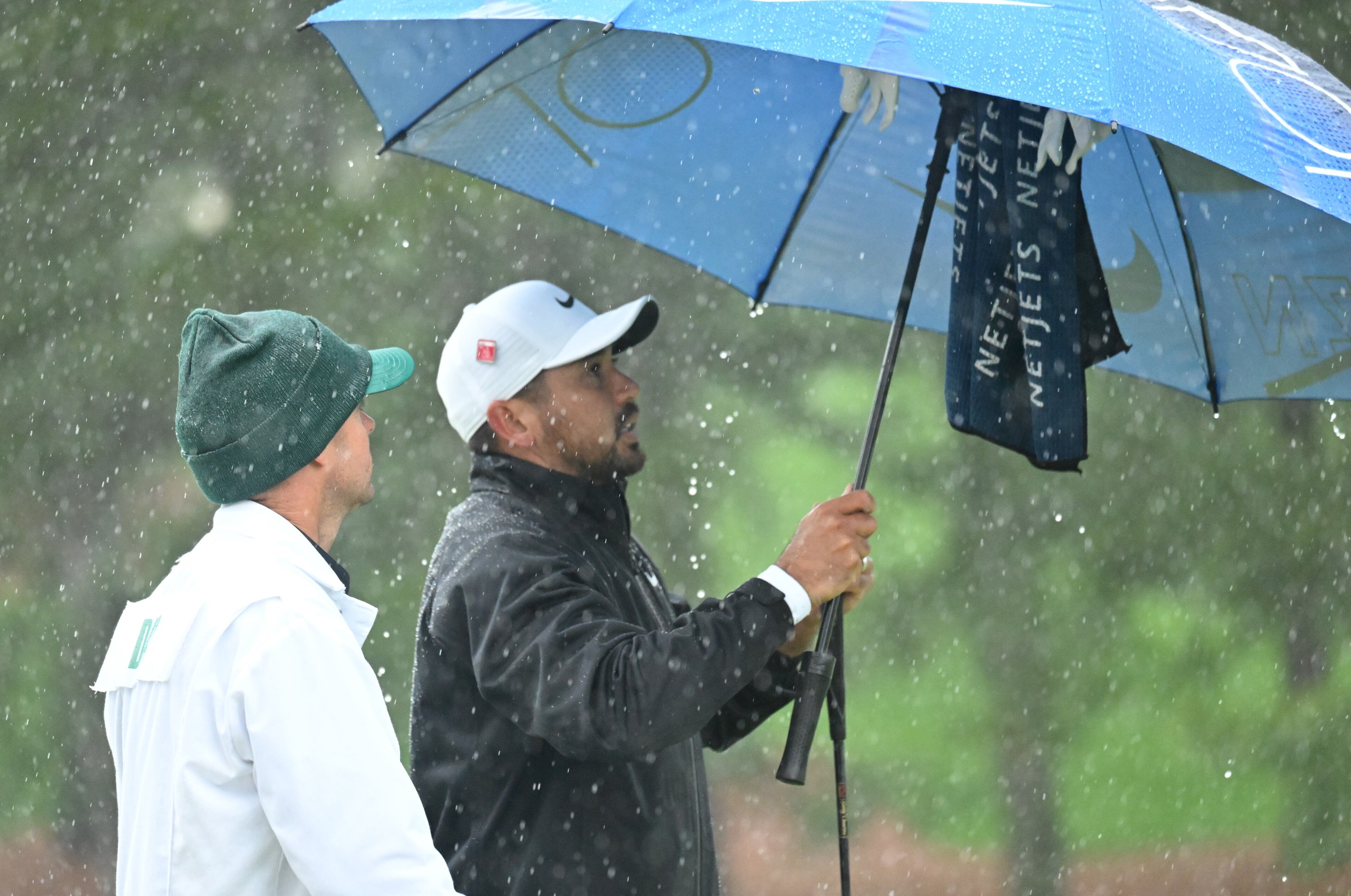 Jason Day waits out rain on seventh hole during third round of the 2023 Masters Tournament at Augusta National Golf Club, Saturday, April 8, 2023, in Augusta, Ga. (Hyosub Shin / Hyosub.Shin@ajc.com)