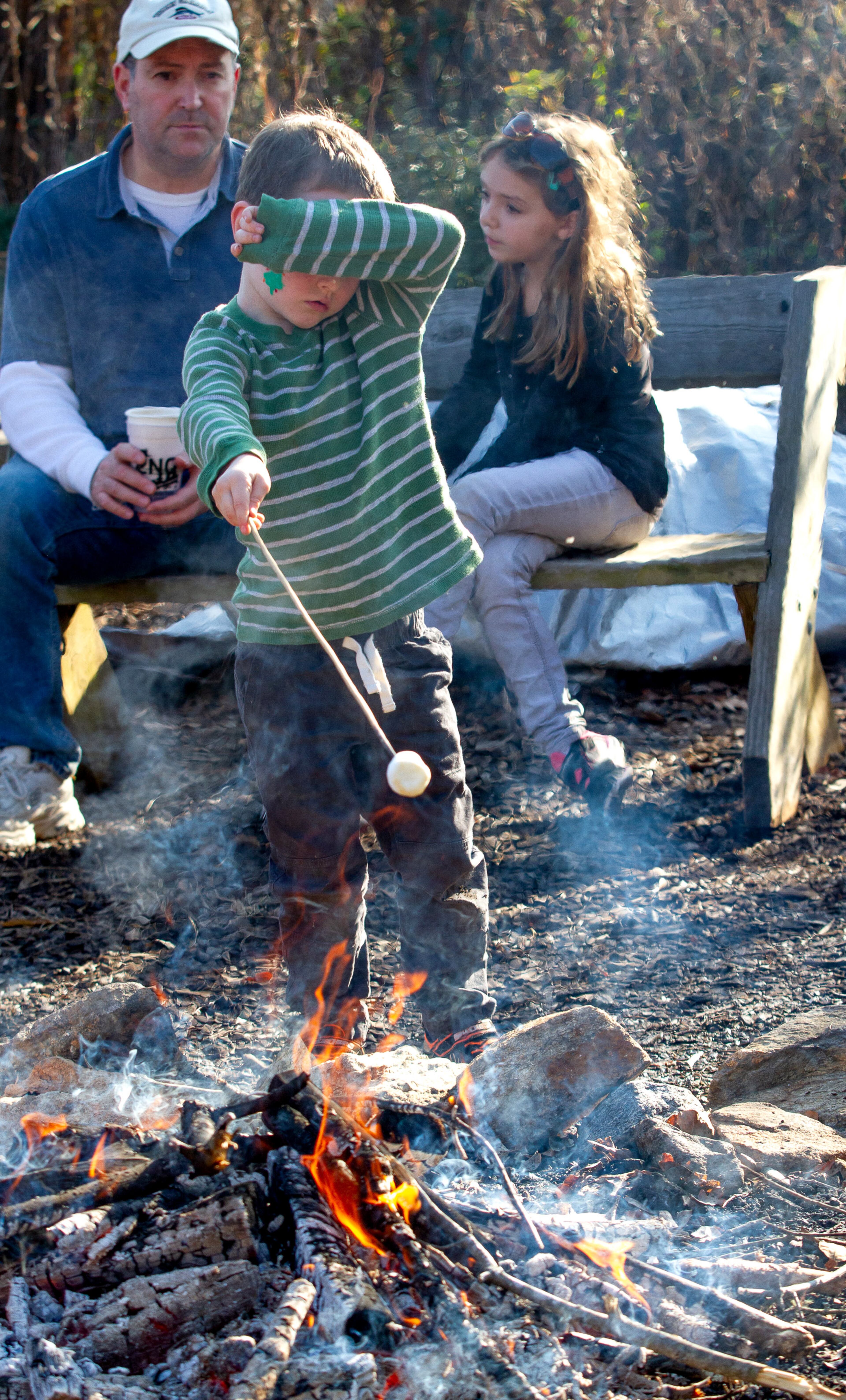 Jordan Fitzgerald makes S'mores over an open fire during the Enchanted Woodland Wonders family fun day at the Chattahoochee Nature Center Sunday, 15 2019. STEVE SCHAEFER / SPECIAL TO THE AJC