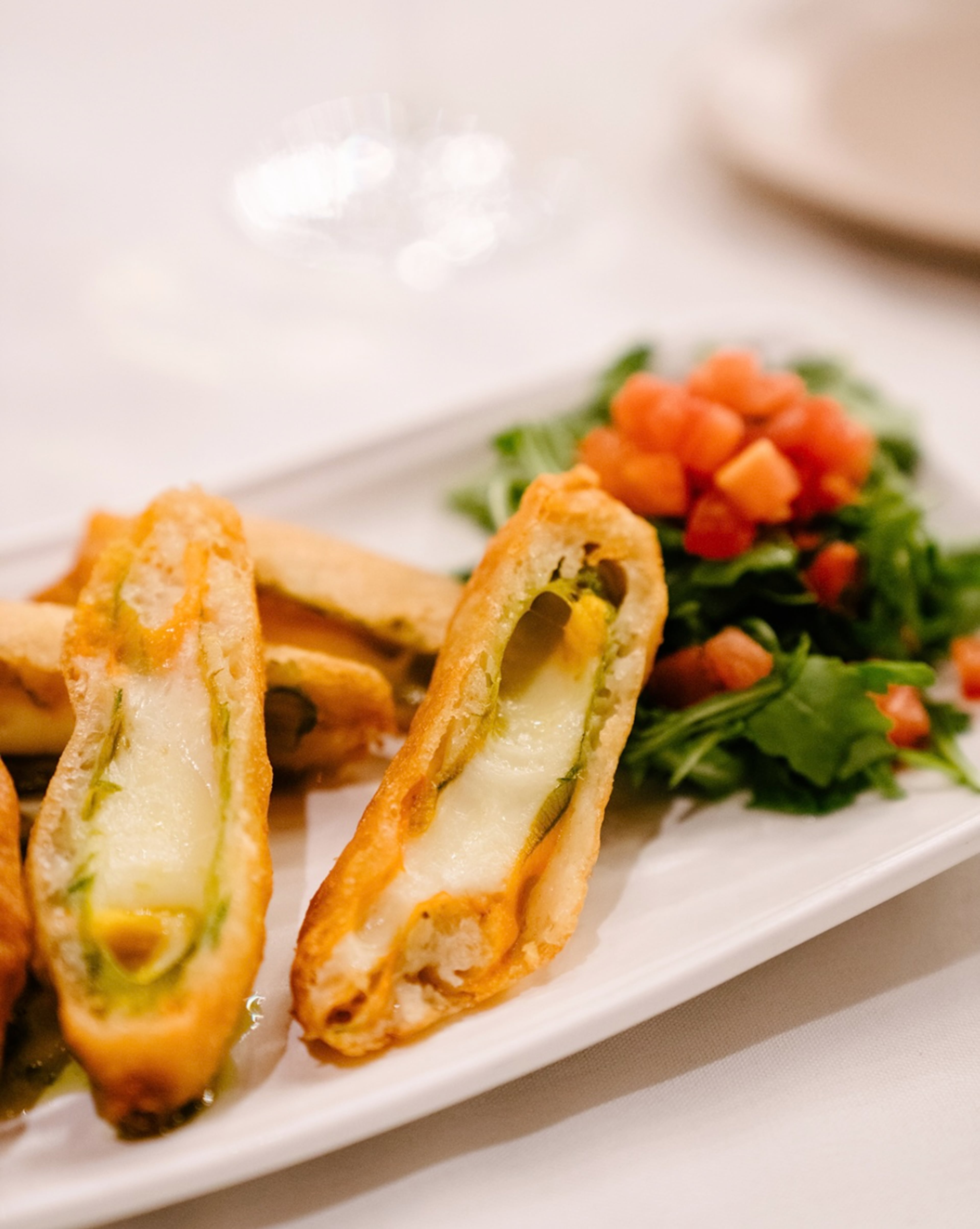 Golden stuffed zucchini blossoms filled with cheeses at Amalfi Cucina + Mercato.
(Courtesy of Zachary Bobo)