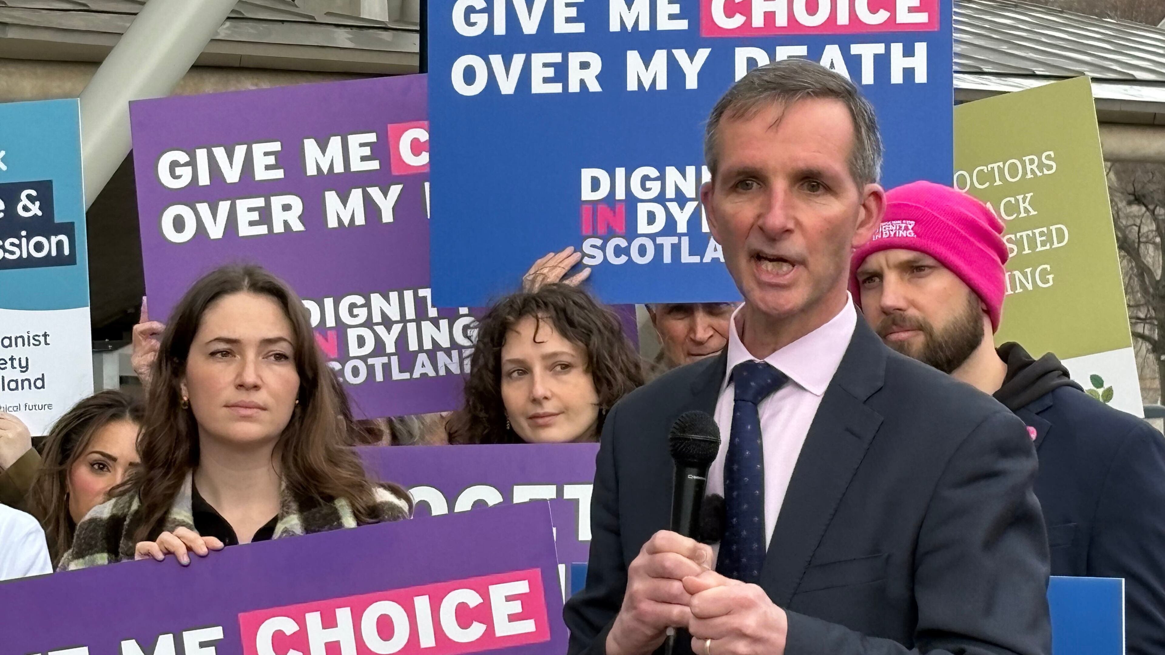 Liberal Democrat lawmaker Liam McArthur joins a rally of supporters ahead of MSPs debating his Assisted Dying for Terminally Ill Adults (Scotland) Bill, in the Scottish Parliament in Edinburgh, Scotland, Tuesday, March 17, 2026. (Neil Pooran/PA via AP)
