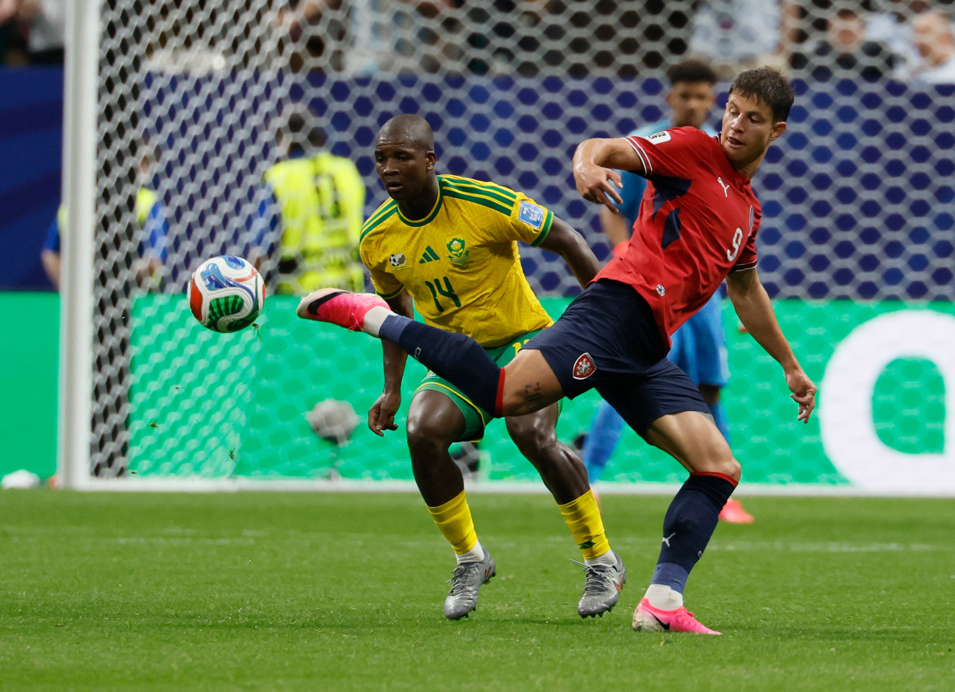 Czechia's Adam Hlozek, right tries to keep the ball away from South Africa's Mbekezeli Mbokazi during second half of Czechia vs. South Africa Group A FIFA World Cup match at Atlanta Stadium (Mercedes-Benz Stadium) on Thursday, June 18, 2026. (Miguel Martinez/AJC)