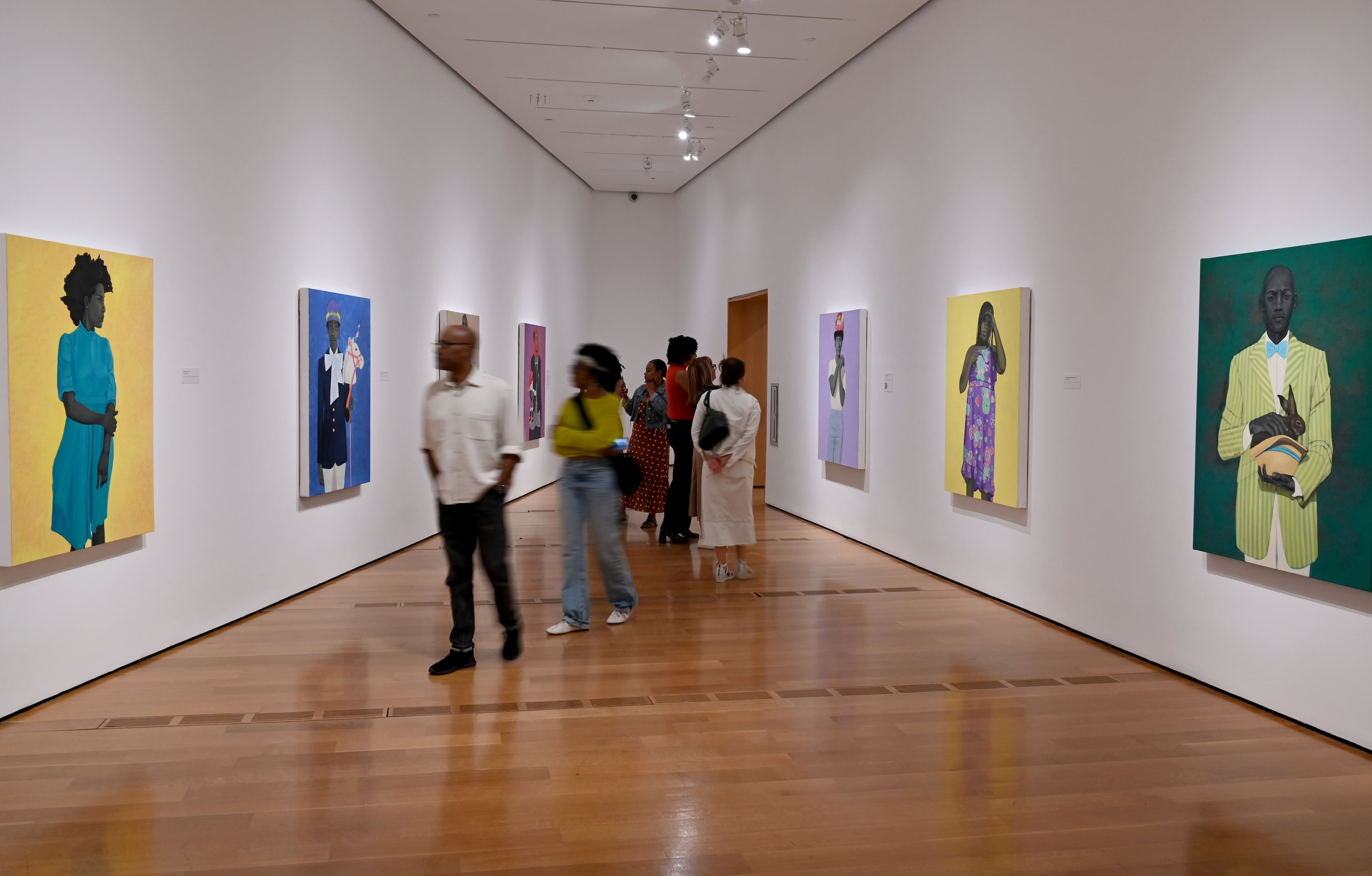 Visitors view Georgia-born artist Amy Sherald’s paintings in the “American Sublime” exhibition at the High Museum of Art on Friday, May 15, 2026, in Atlanta. (Hyosub Shin/AJC)