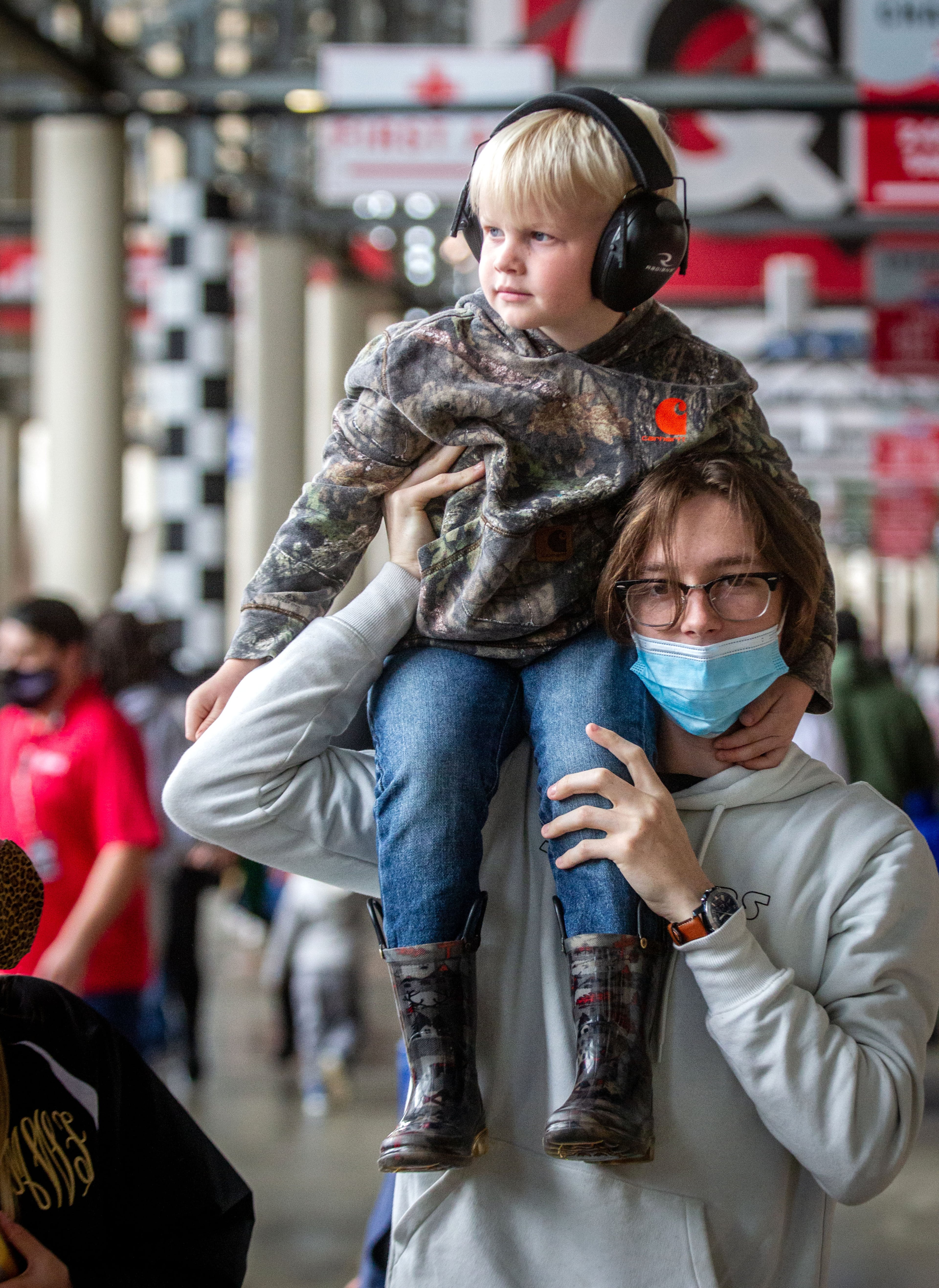 Brantly Gabbard, 4, rides on Tyler Dendy's shoulders before the start of Monster Jam at Atlanta Motor Speedway on Saturday, April 24, 2021. (Photo: Steve Schaefer for The Atlanta Journal-Constitution)