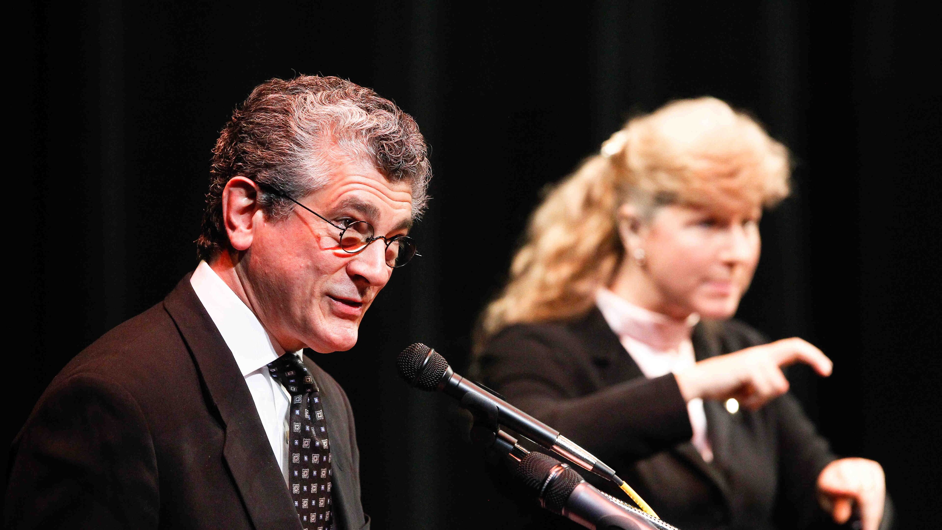 Evans Mirageas, Harry T. Wilks Artistic Director of Cincinnati Opera, shares memories of Harry T. Wilks during a memorial service held Saturday, March 29, 2014, to celebrate his life at Miami University Hamilton's Parrish Auditorium. NICK DAGGY / COX NEWSPAPERS