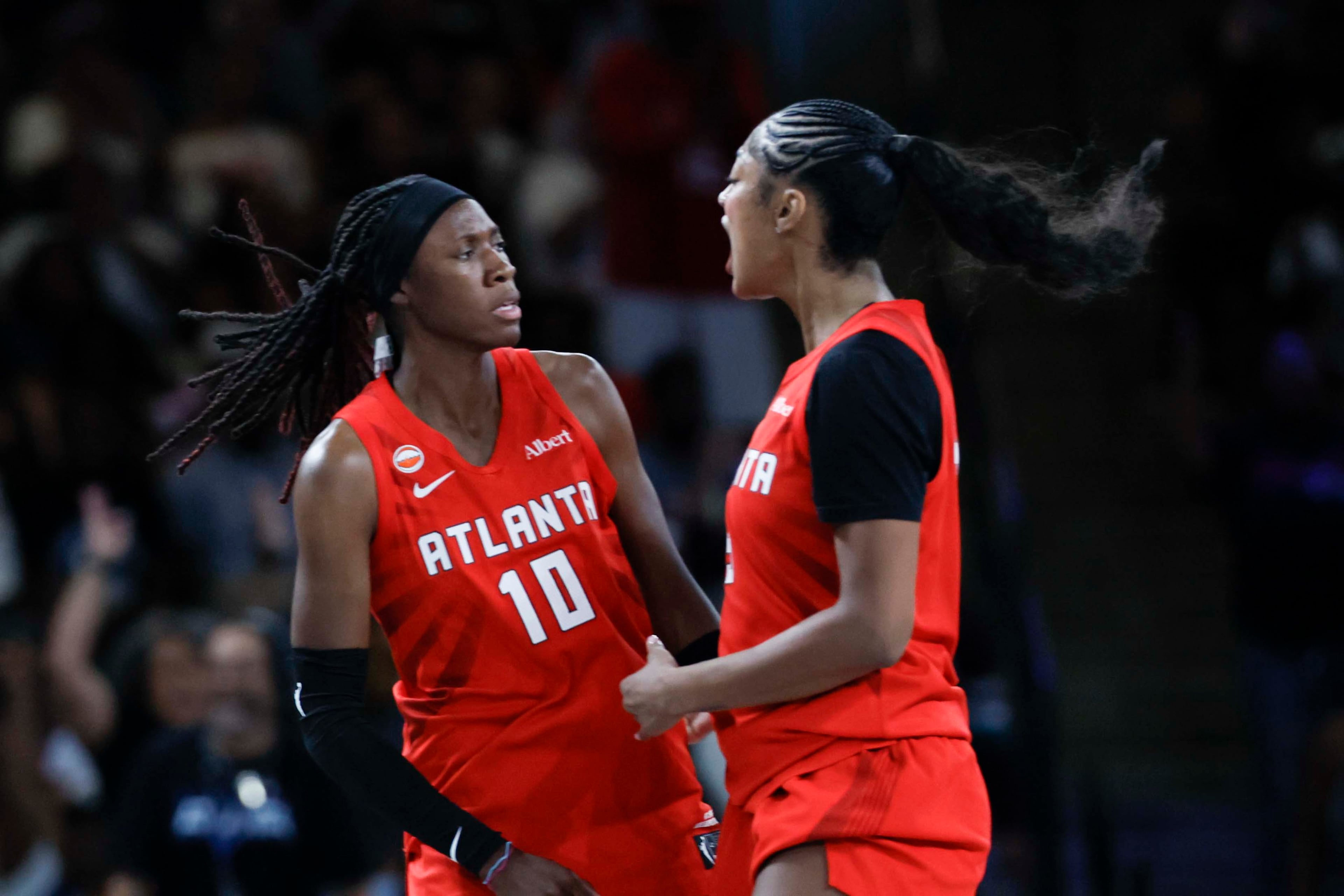 Dream guard Rhyne Howard (left) celebrates with forward Angel Reese after scoring a 3-pointer against the Lynx at Gateway Center Arena on Sunday, Aug. 30, 2026, in Atlanta. (Miguel Martinez/AJC)