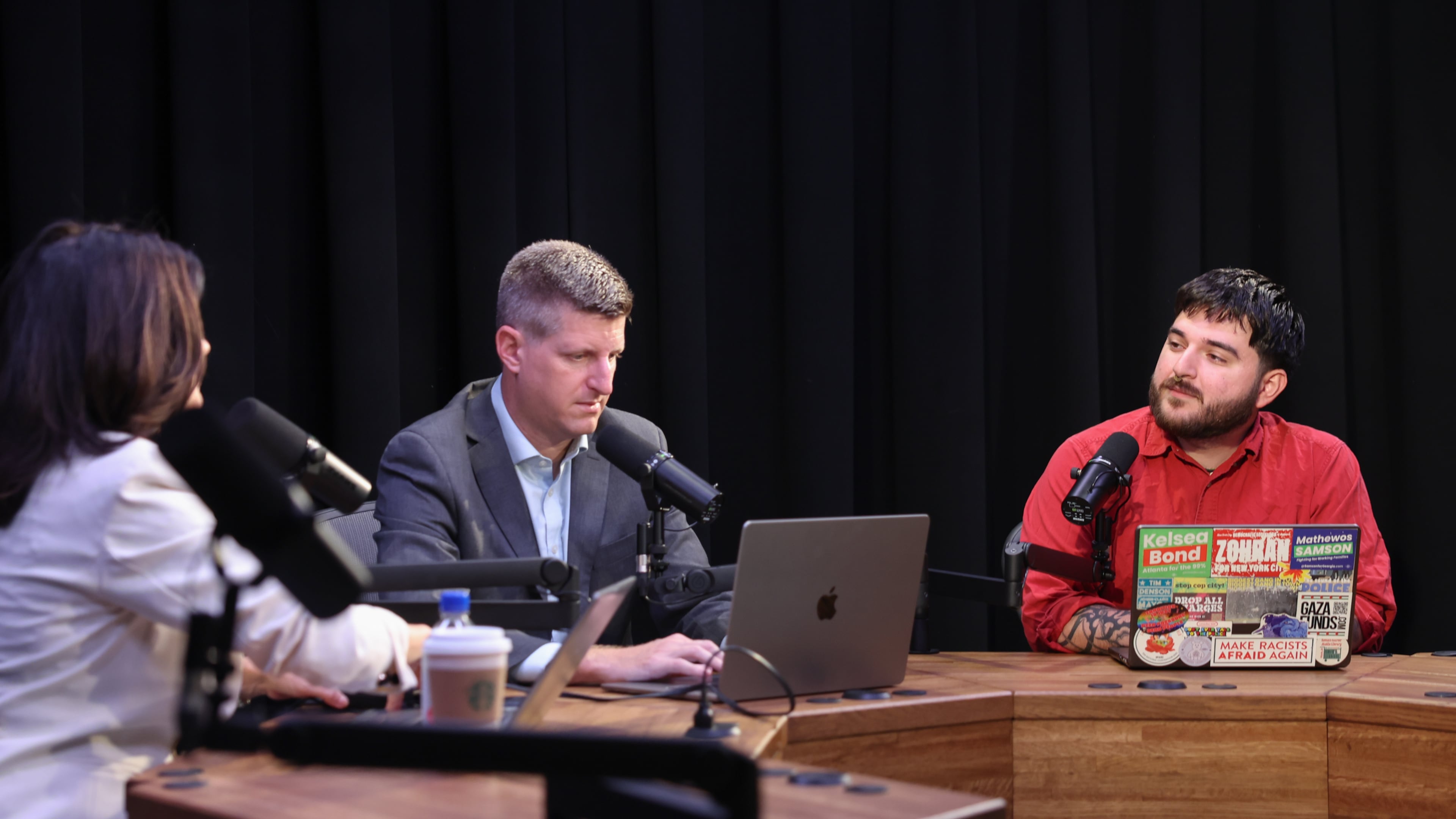 (From left) AJC’s Patricia Murphy and Greg Bluestein prepare for a "Politically Georgia" podcast recording with Brayan Ramirez, co-chair of the Atlanta Democratic Socialists of America (DSA), at the AJC office in Atlanta on Aug. 31, 2026. (Arvin Temkar/AJC)