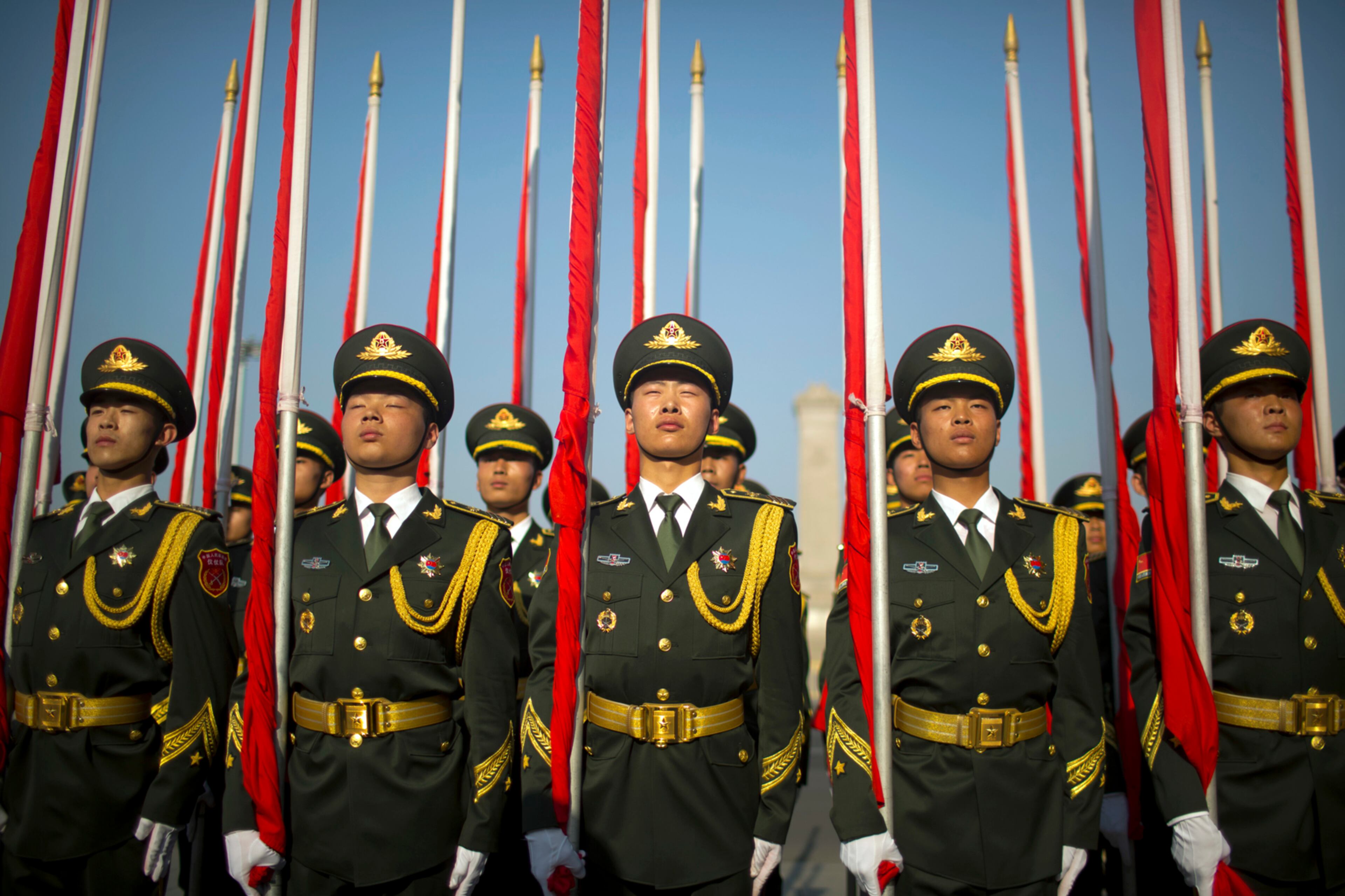 Flagbearers of a Chinese honor guard stand in formation before a welcome ceremony for Argentina's President Mauricio Macri at the Great Hall of the People in Beijing, Wednesday, May 17, 2017. (AP Photo/Mark Schiefelbein)