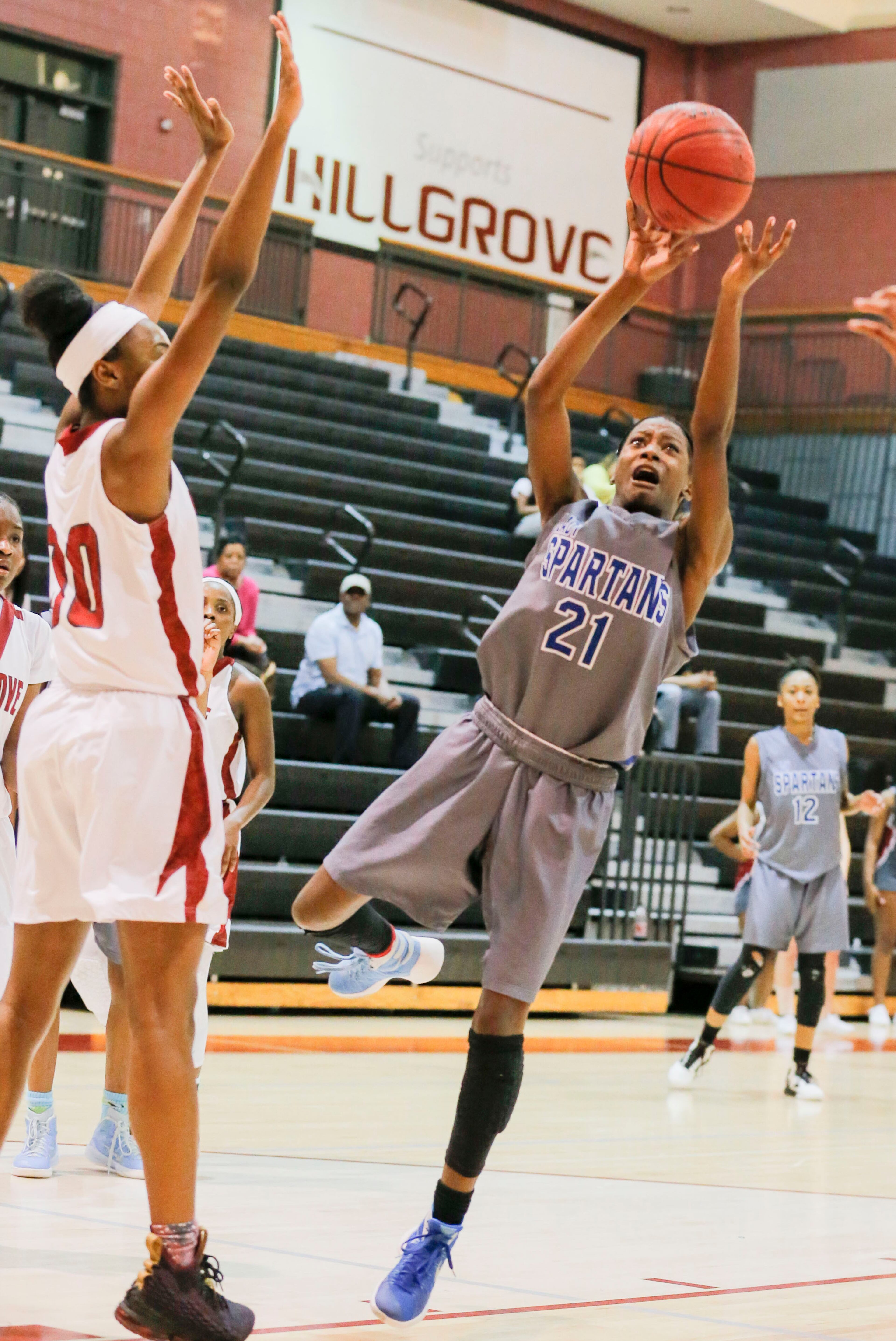 02/21/2018 -- Powder Springs, GA - Lady Spartans' Jaleah Alston (21) shoots the ball during the second half of the game against the Lady Hawks at Hillgrove High School, Wednesday, February 21, 2018. The Campbell High School Lady Spartans lost to the Hillgrove High School Lady Hawks, 60-65. ALYSSA POINTER/ALYSSA.POINTER@AJC.COM